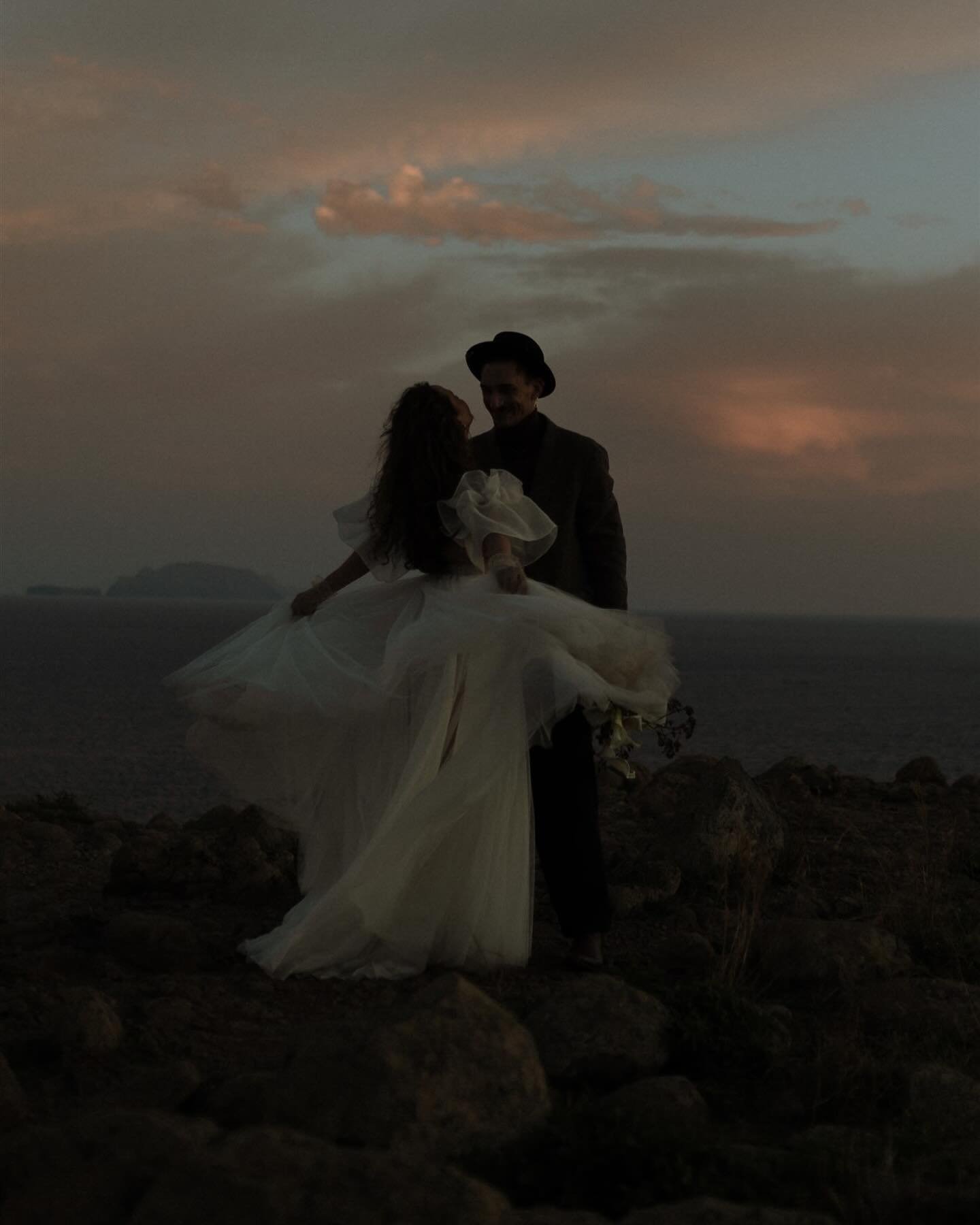 Dancing on the edge of the world, with love as our guide. Madeira&rsquo;s cliffs and the setting sun paint the perfect backdrop for their journey into forever. 

#DestinationDreams #madeiramagic #sunsetvows 

Concept @glowsperience @matiphotography @
