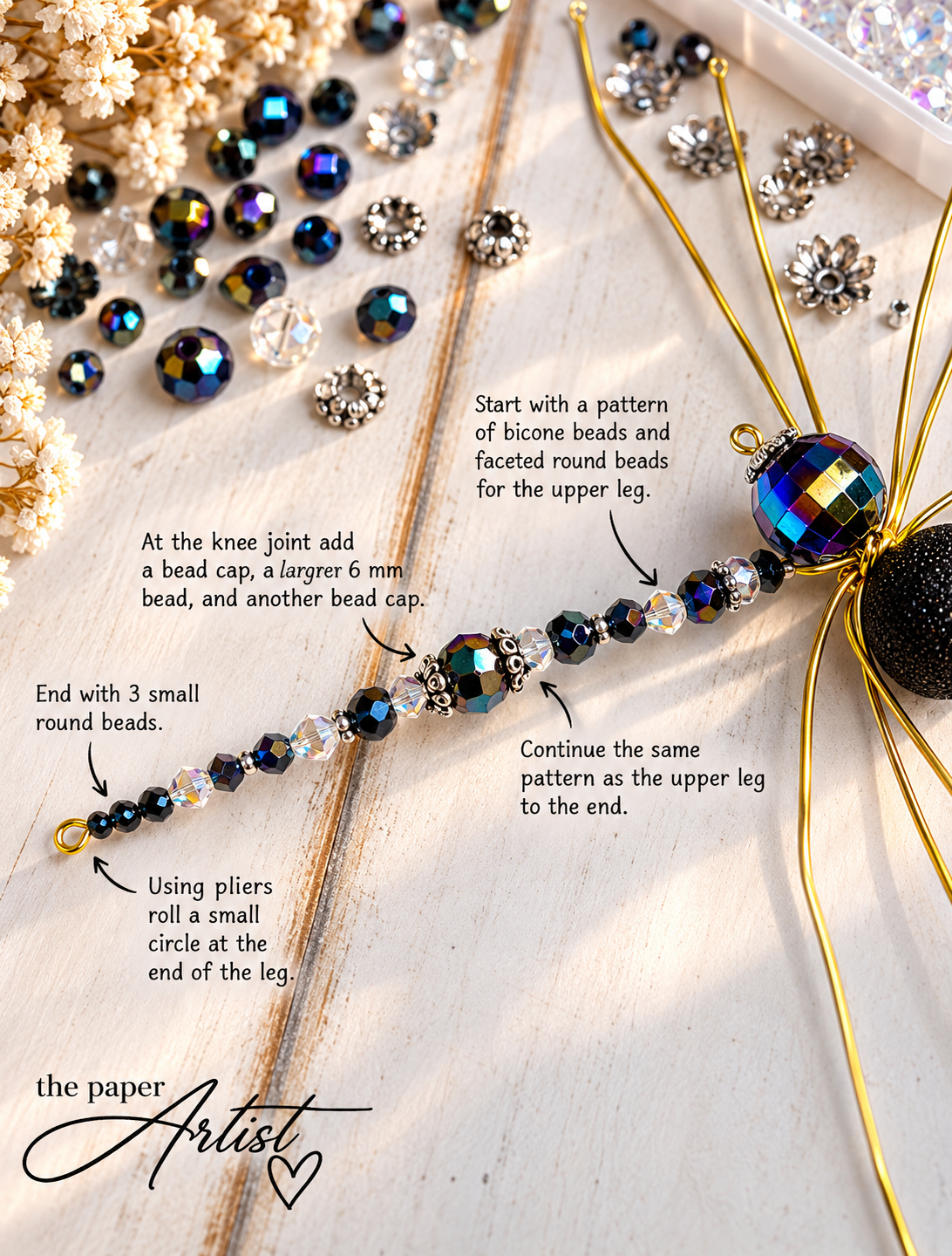 Black and clear faceted beads threaded onto a wire spider leg