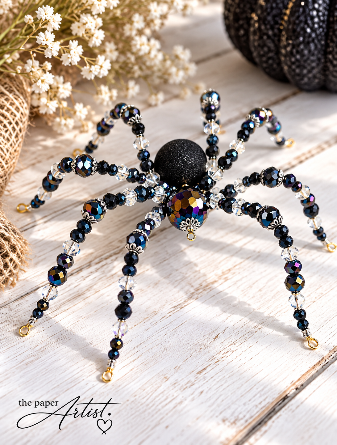 Finished DIY Halloween spider with sparkling black and clear beaded legs