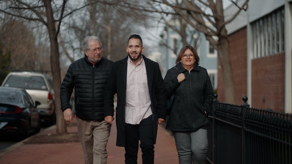 Diego Alzugaray with his mother and father filming with Mwendo in Washington D.C.