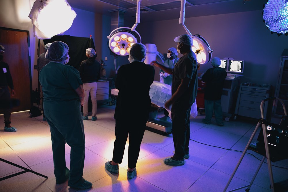Behind the scenes in a BridgePoint Healthcare surgery room, filming their brand anthem with Mwendo.