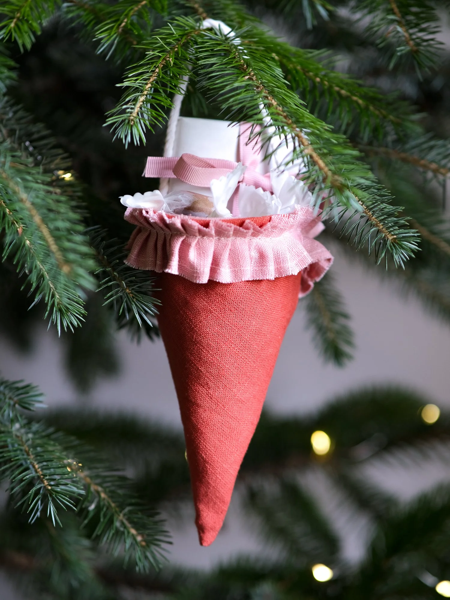 Reusable Victorian Christmas gift cones for hanging beneath festive greenery, featuring delicate ruffled trim.