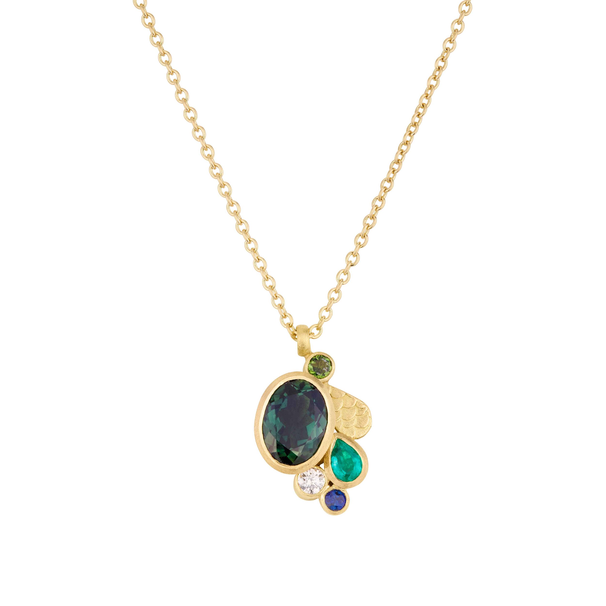 Gold chain necklace with a cluster pendant featuring a large oval dark green stone and smaller multicolored gemstones.