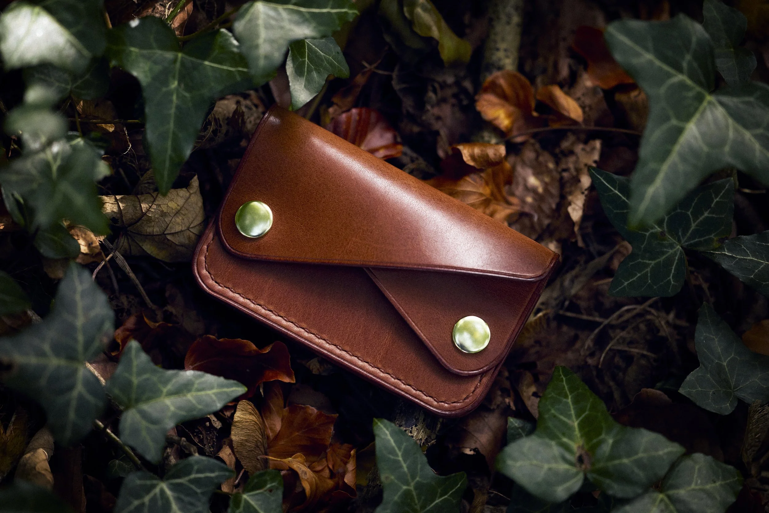 leather wallet, product photography, woodland, commercial photography