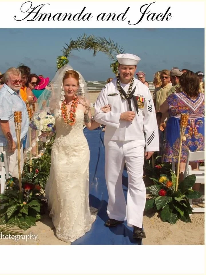 Tropical Arch with Bamboo poles and palm frond arch.