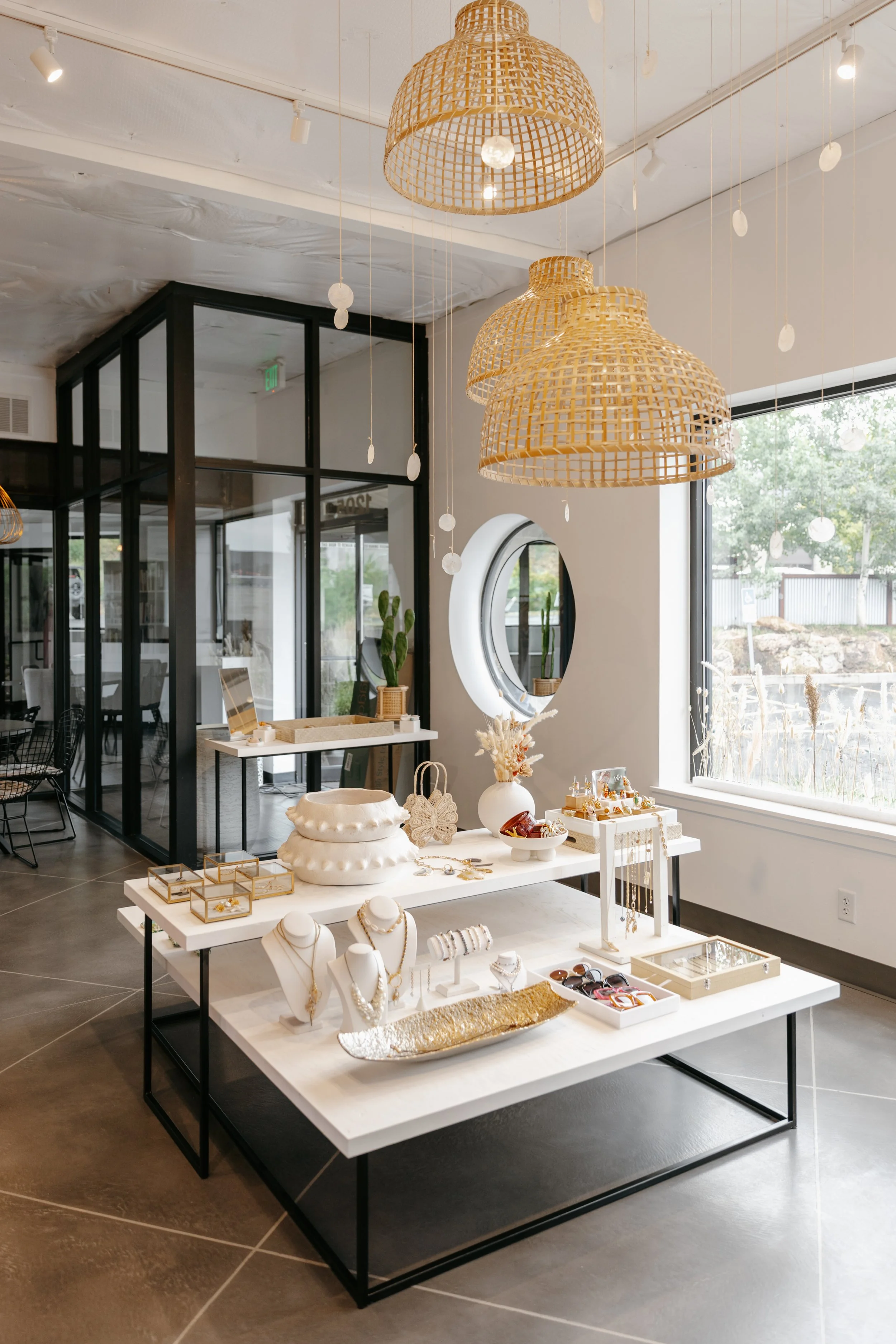 Custom jewelry and vases displayed in a bright showroom. DistriktF Park City Brand Pop-Up Rental Space.