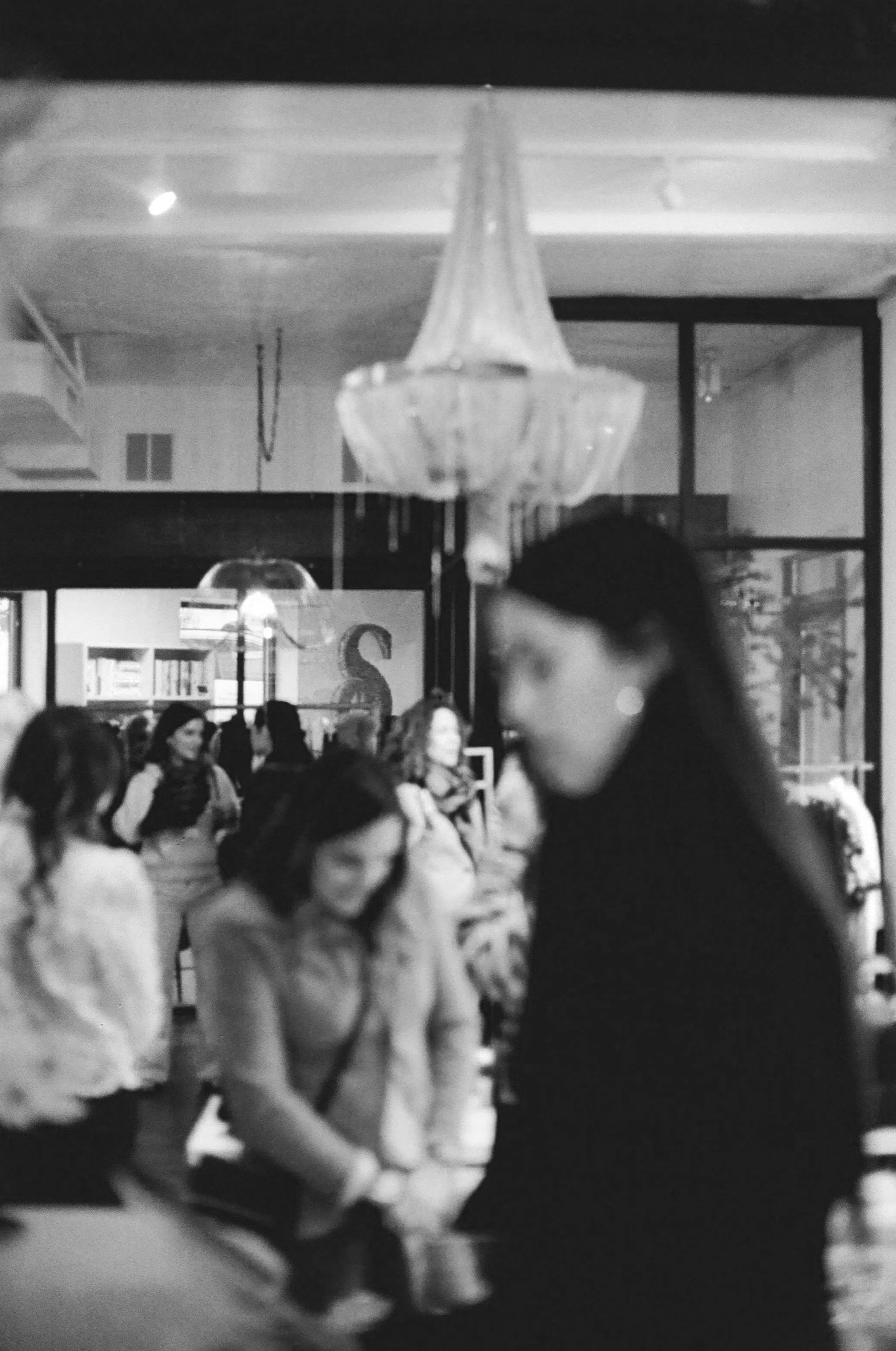 Group of women mingling and browsing the event space. DistriktF Park City Event Space Rental.