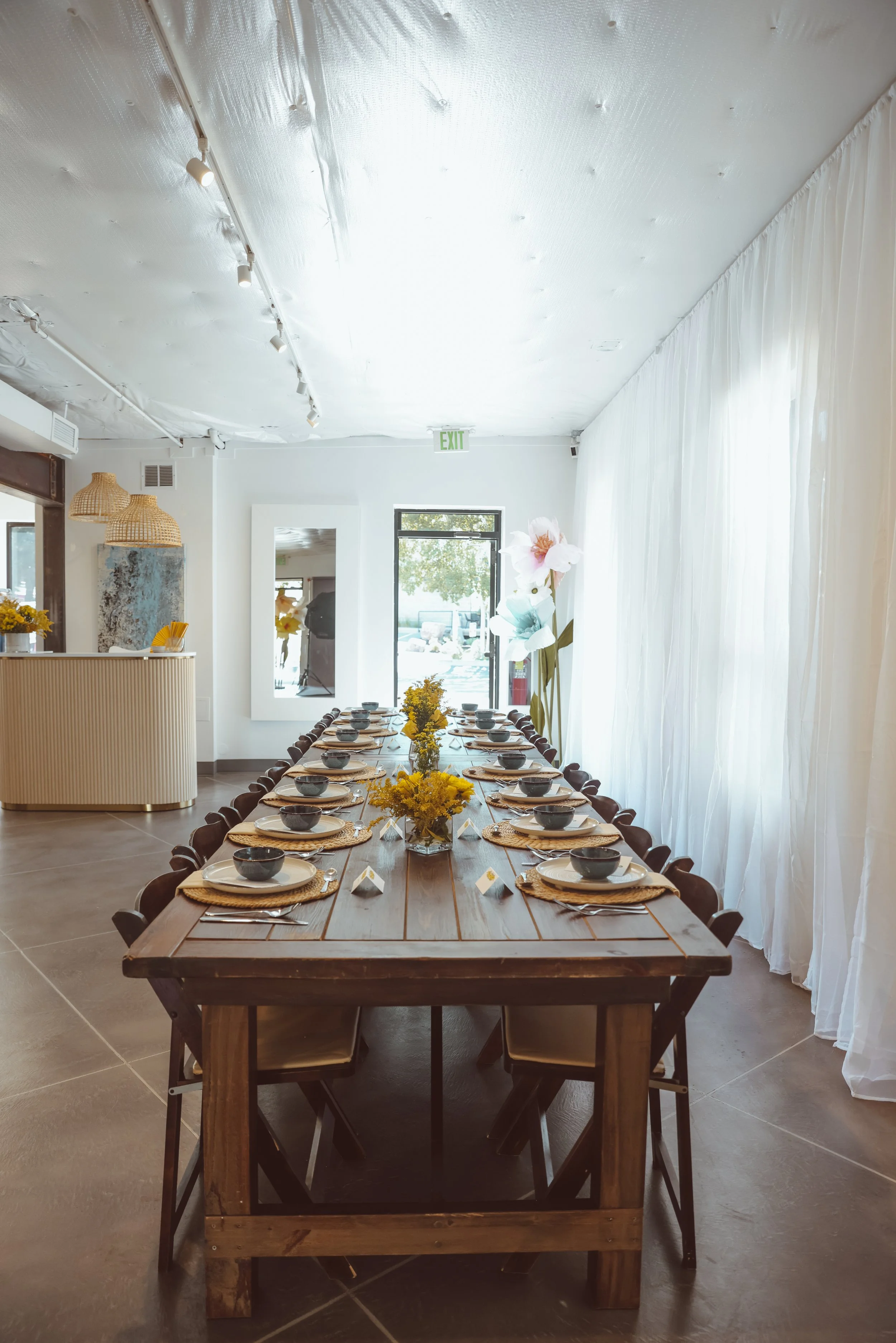 Long table with elevated floral theme. DistriktF Park City Event Space Rental.