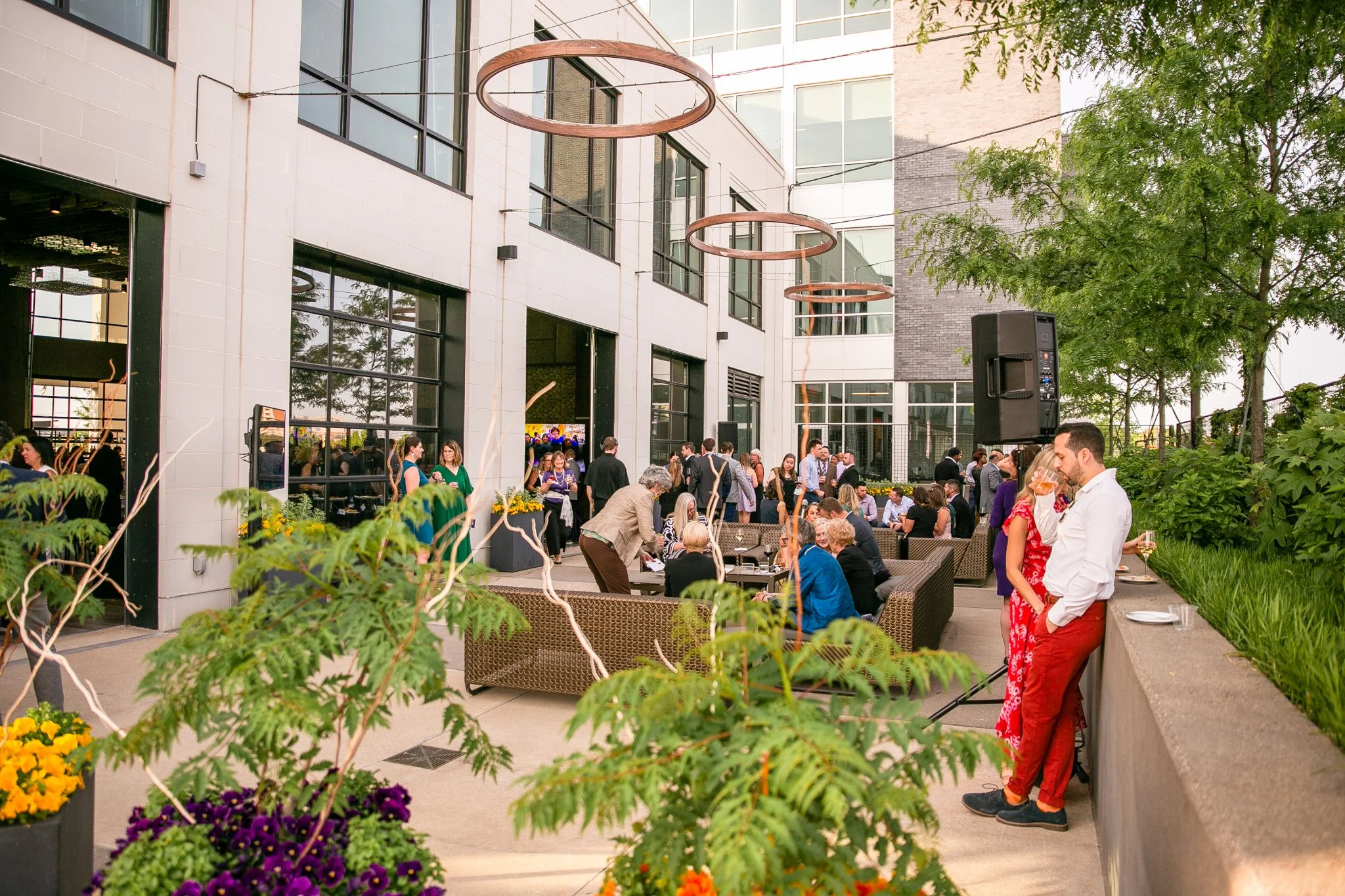 Corporate guests enjoy a lively weekday networking event on the outdoor terrace at The Fives Columbus — a modern, affordable venue offering stylish spaces for business celebrations and professional gatherings.