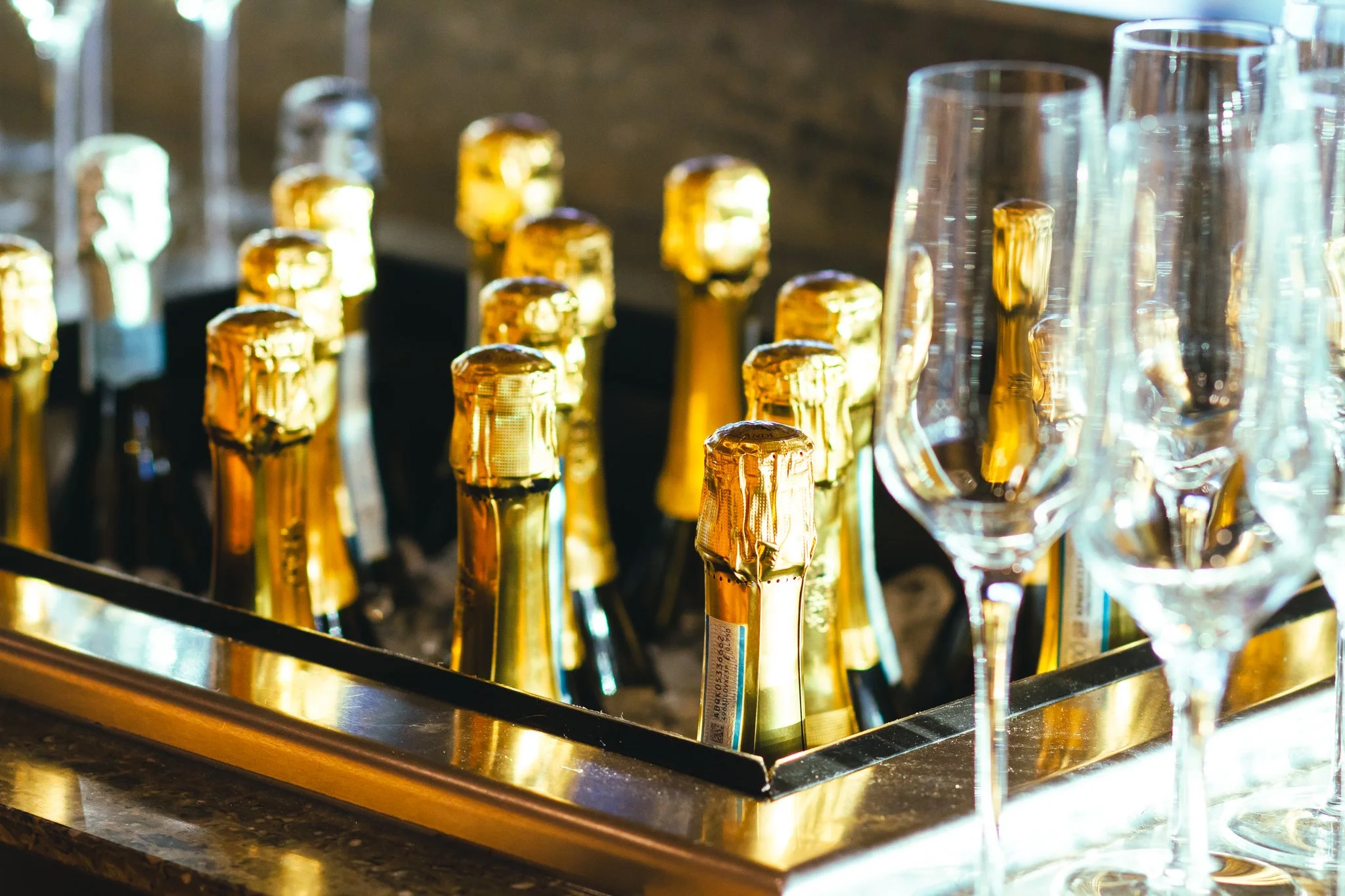Chilled champagne bottles and sparkling glassware ready for a rooftop toast at The Fives Columbus — ideal for midweek corporate celebrations with upscale service.