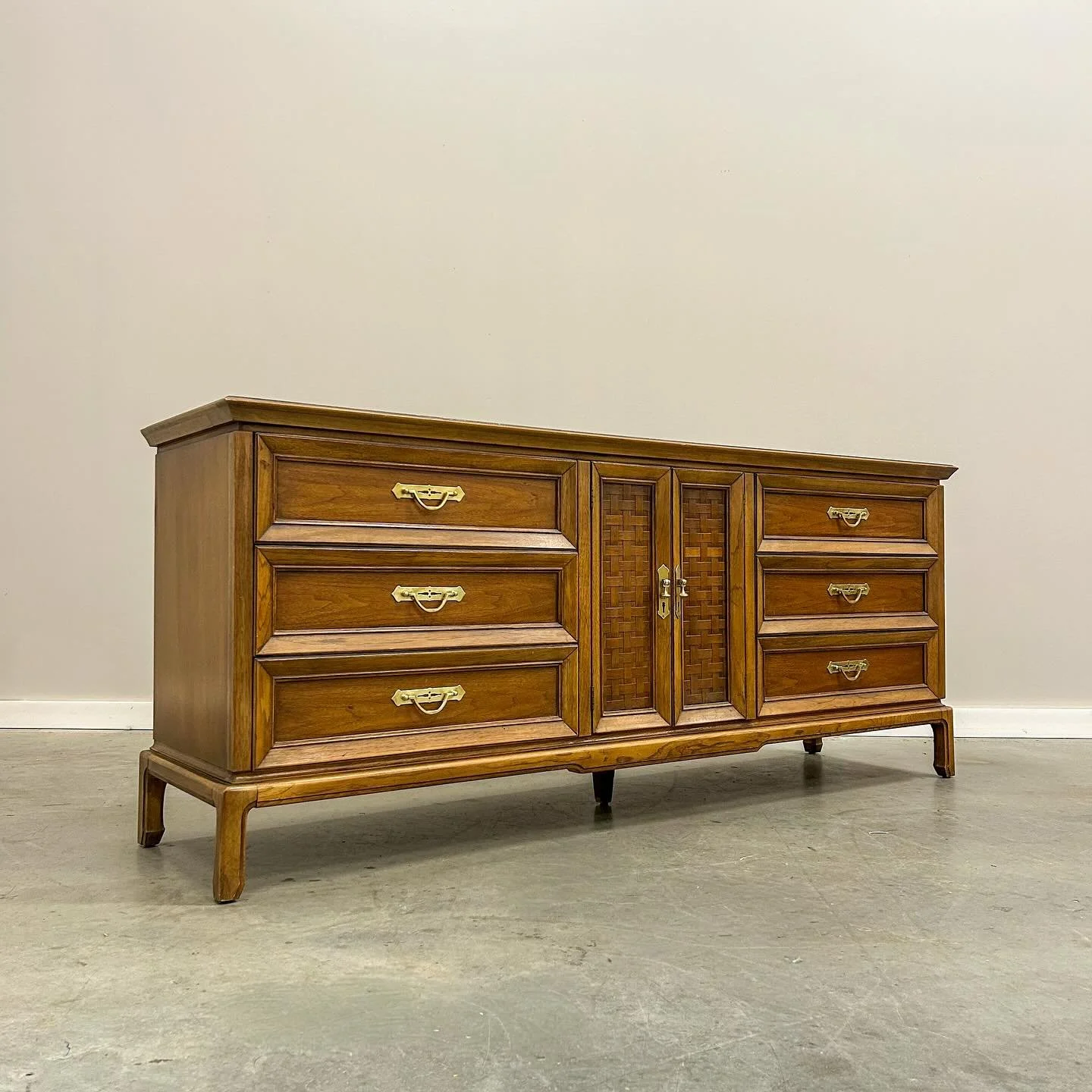 This nine drawer Thomasville dresser leans a bit more traditional than what I usually bring in, but I couldn&rsquo;t resist its potential. The piece came alive after refinishing the top and polishing decades of tarnish from the pulls. And those woven