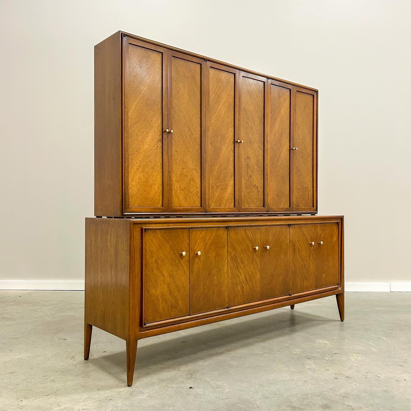 A standout from Mount Airy&rsquo;s Facade collection and my favorite find so far. Architectural door fronts, sculpted lines, polished brass, and impressive storage with drawers, dividers, and shelves throughout. True Mid-Century craftsmanship built t