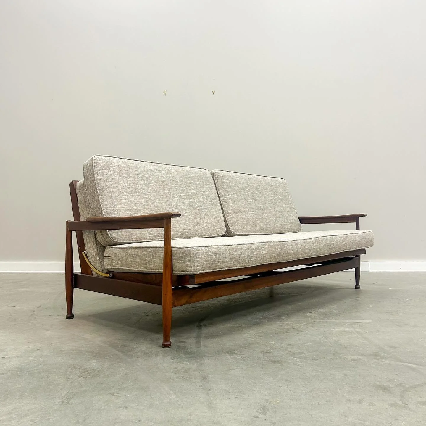 SOLD. Guy Rogers designed the Manhattan sofa bed to feel good and look better. Solid walnut frame, all new straps  underneath, and a smooth slide into a bed when the night runs long. Mid-century comfort that&rsquo;s ready for real life. Matching set 