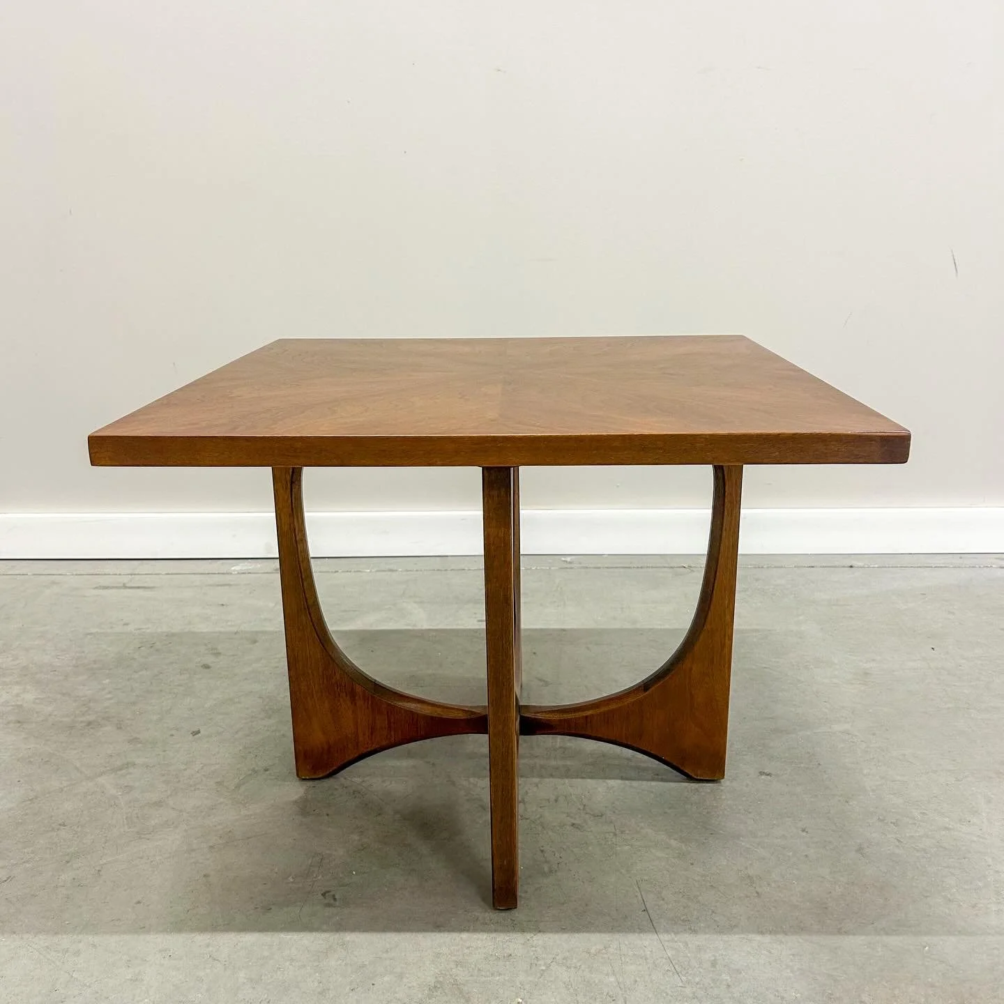 SOLD. This Broyhill Brasilia lamp table blends a starburst walnut top with graceful mid-century lines, offering far more architectural presence than its modest footprint suggests. Available now.

26&rdquo; W x 26&rdquo; D x 20&rdquo; H

#mcmfurniture