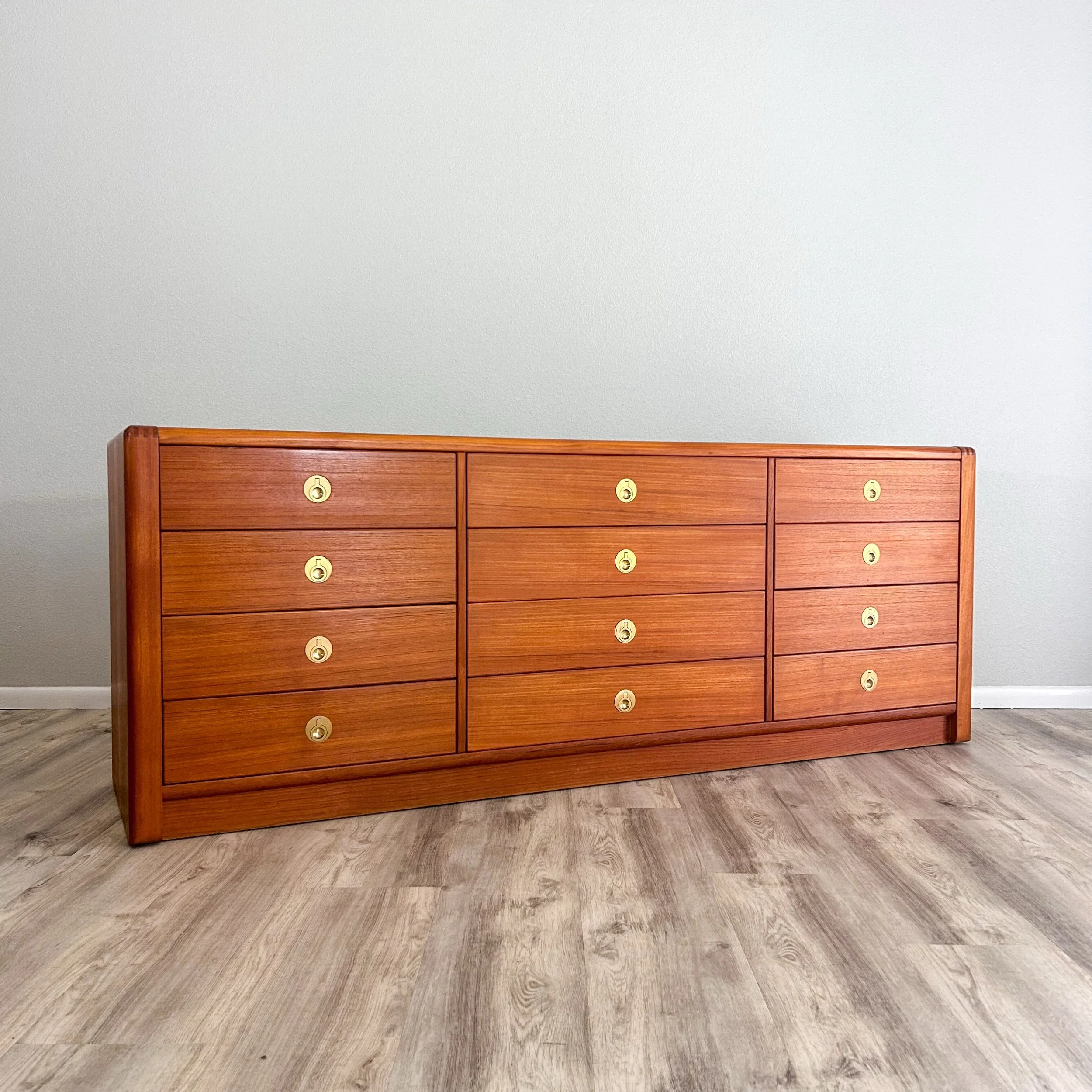 A stately 12 drawer teak dresser from D-Scan&rsquo;s Captain Line with incredible brass pulls. Generous storage for all your organizational needs! Available now at highvintagedecor.com

78&rdquo; L x 19.5&rdquo; D x 29.5&rdquo; H

#TeakDresser #MidCe