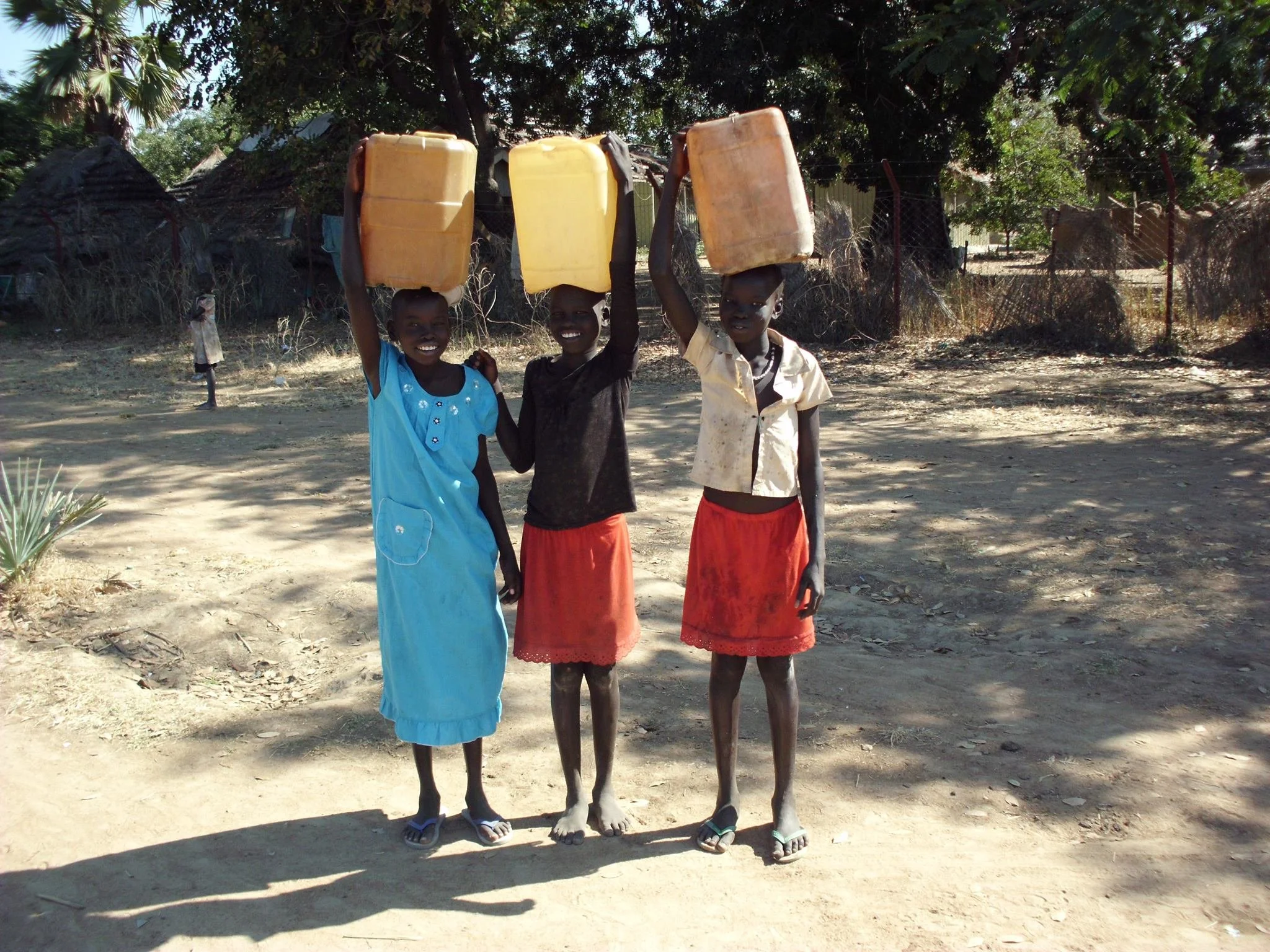 LBRSS_Aweil-SouthSudan_3GirlsWBuckets.jpeg