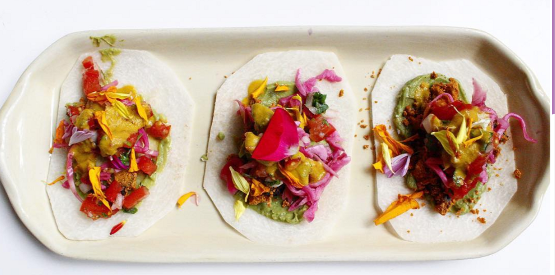 Raw Jicama Tortillas with Tropical Filling, Walnut "Meat," Cashew Cream, and Guacamole