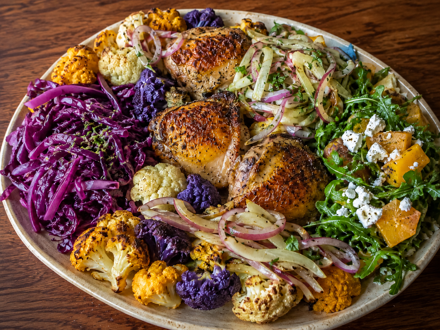 Rosemary-Thyme Chicken Thighs with Roasted Tricolor Cauliflower, Coco-Lime Cabbage, Golden Beet &amp; Feta Salad, and Marinated Fennel-Red Onion