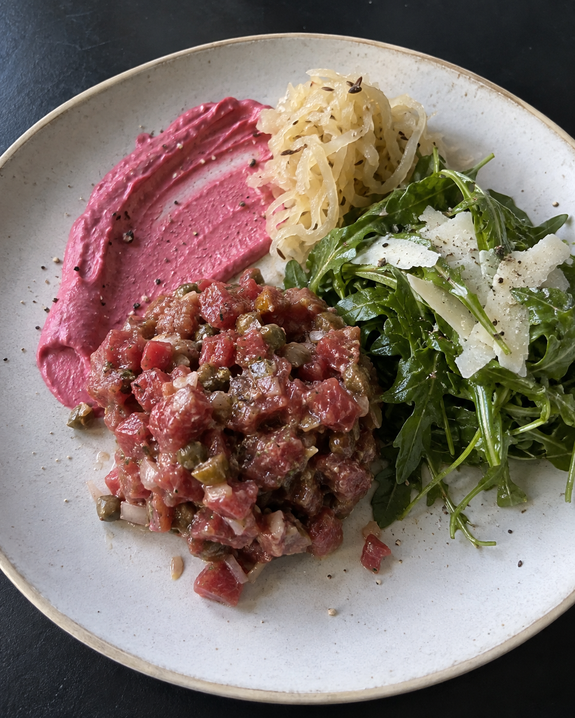 Steak Tartare with Beet Cream, Raw Sauerkraut, and Parmesan-Arugula Salad