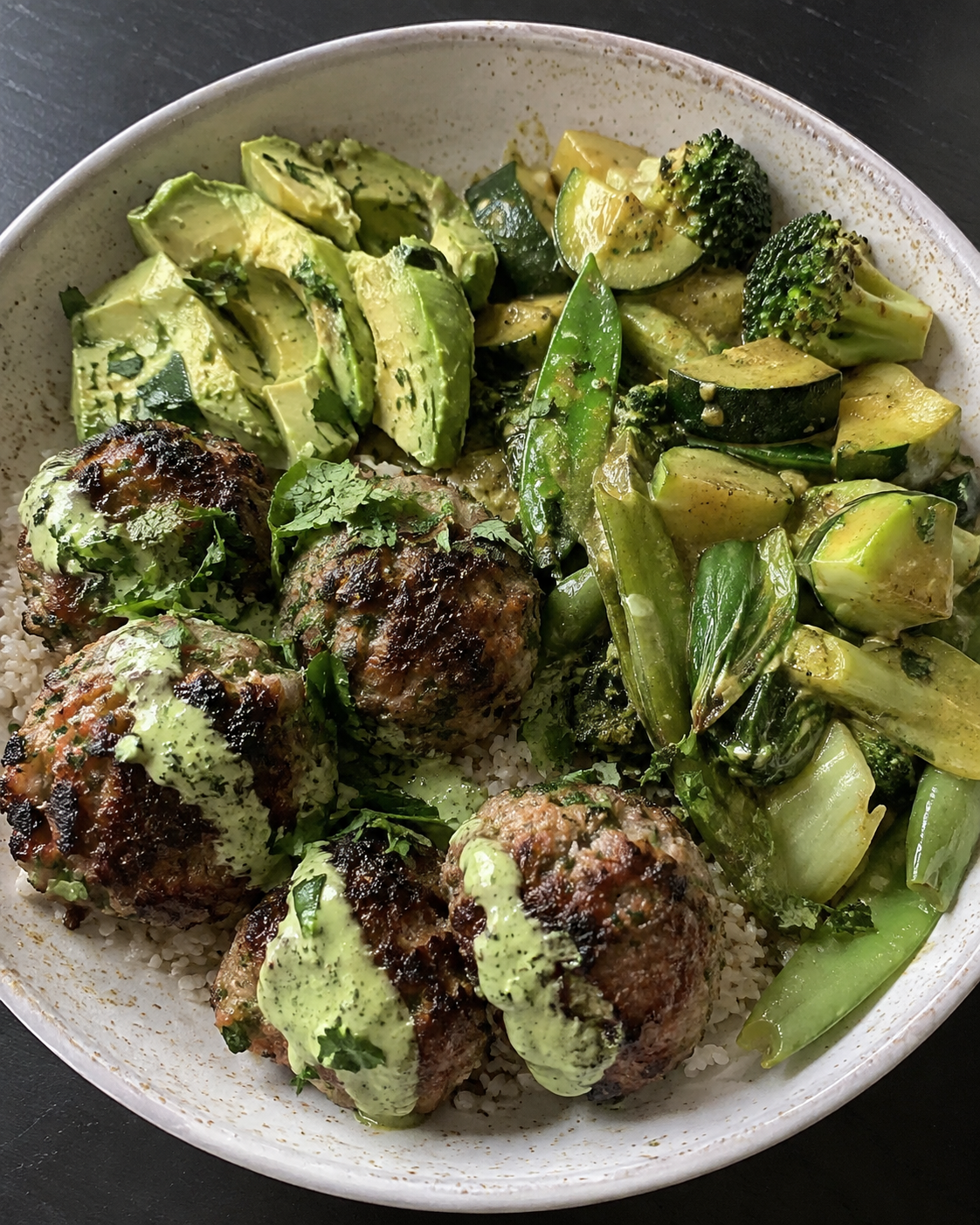 Lamb Meatballs with Cilantro-Lime Sauce, Avocado, and Green Curry Vegetables