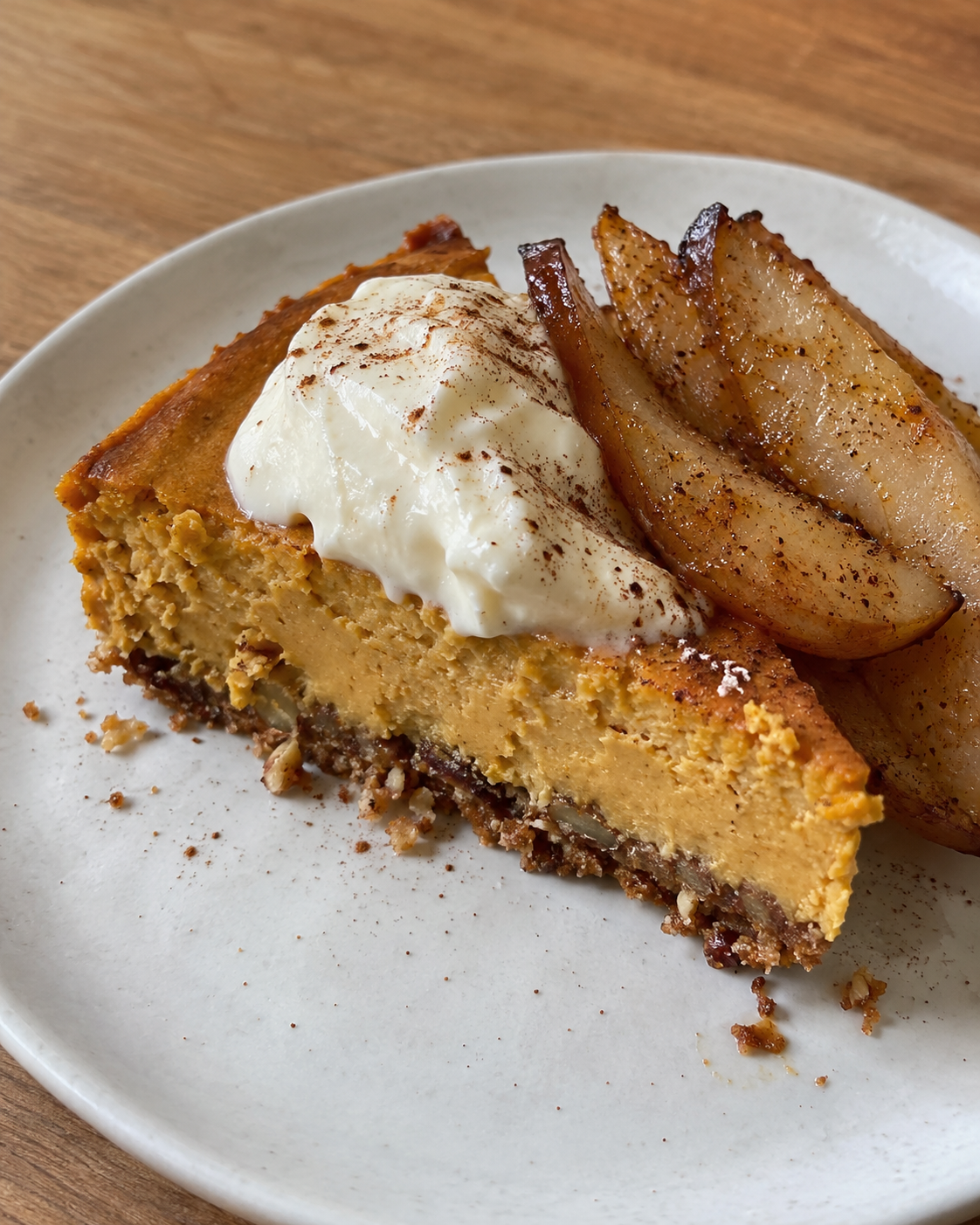 Kabocha Squash Cheesecake with Pecan-Almond Crust, Vanilla Goat Cream, and Cinnamon-Roasted Pears