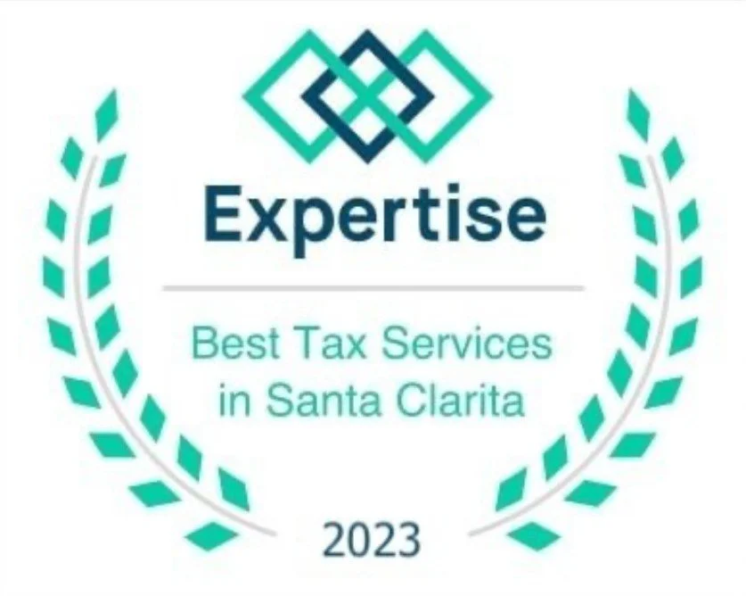 An award badge with green laurel wreath surrounding the text. At the top, there is a geometric, interlocking diamond design in teal. Below it, text reads "Expertise" in bold, followed by "Best Tax Services in Santa Clarita" and "2023" at the bottom.