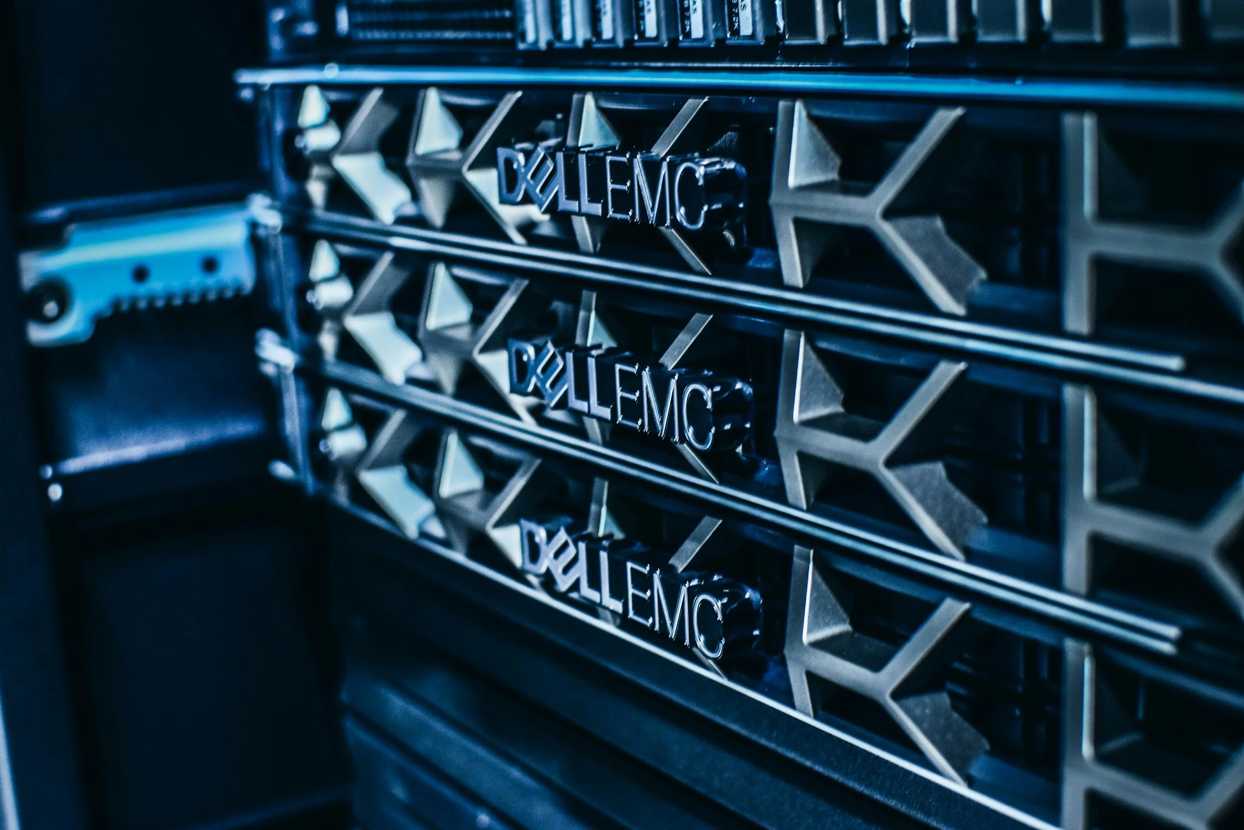 Close-up view of Dell EMC servers with stacked hardware in a data center.