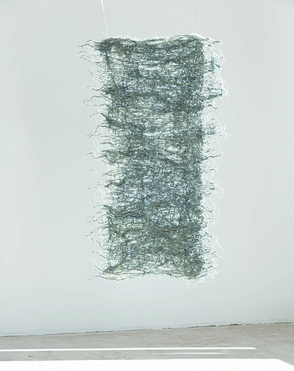 Wheatgrass root, naturally dyed with indigo, measures 83 x 50cm