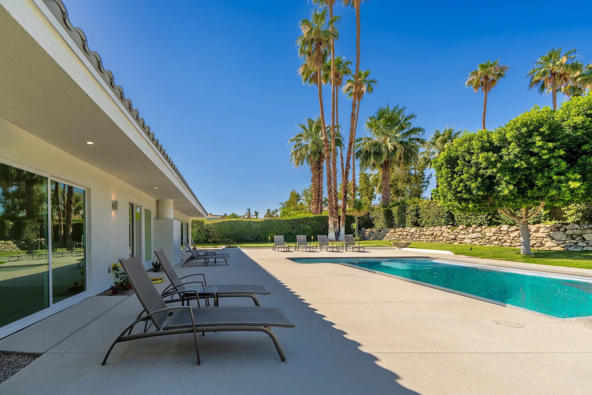 Lifestyle photo of a patio and pool in a modern desert home