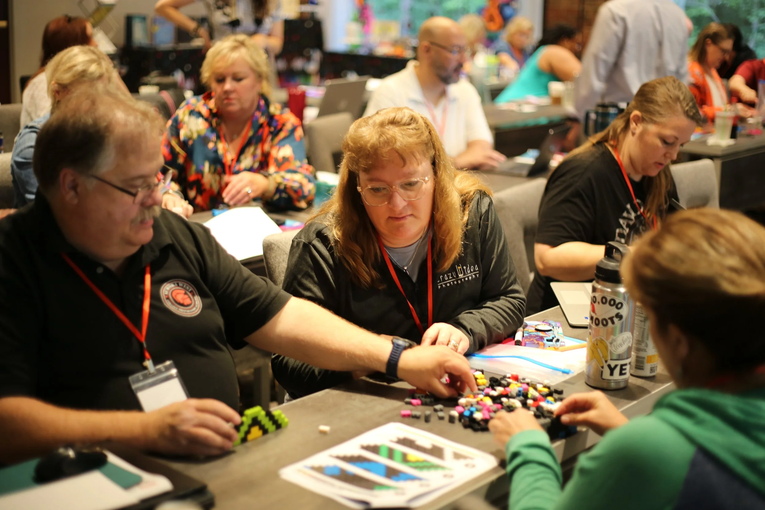 Advisors building legos at 2024 conference