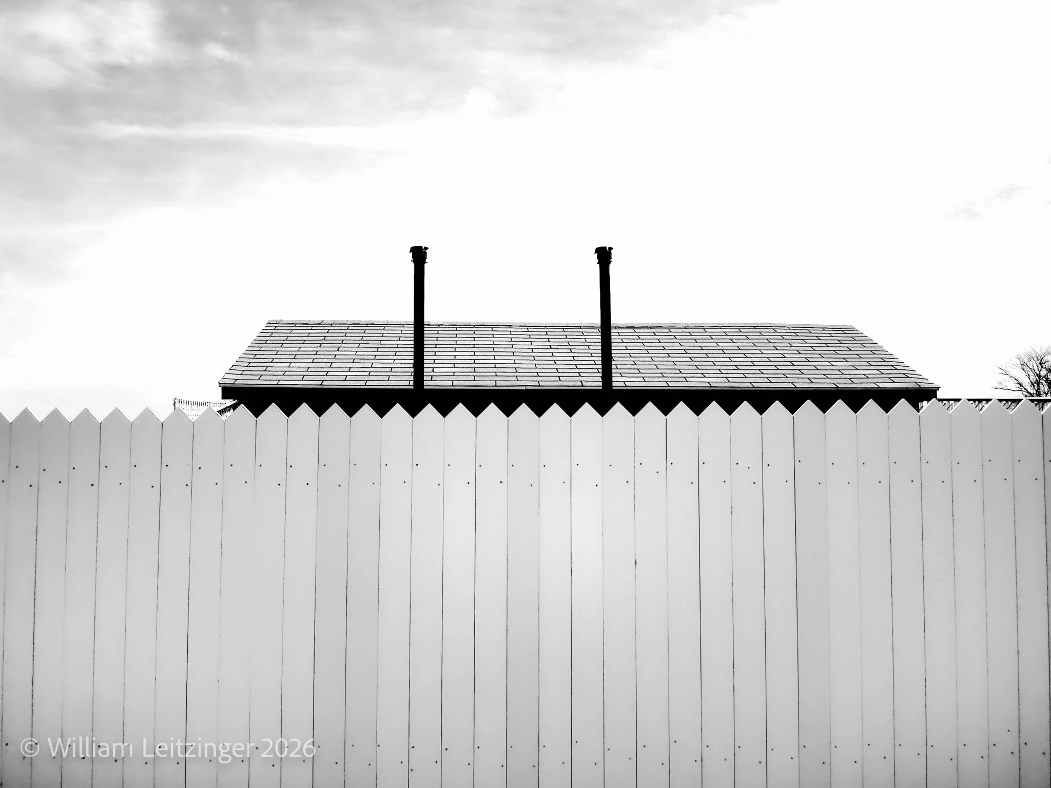20070413-Urban-Abstract-DE-Delaware-Fence_with_Building_Roof-01-B&W-(Copyright).jpg