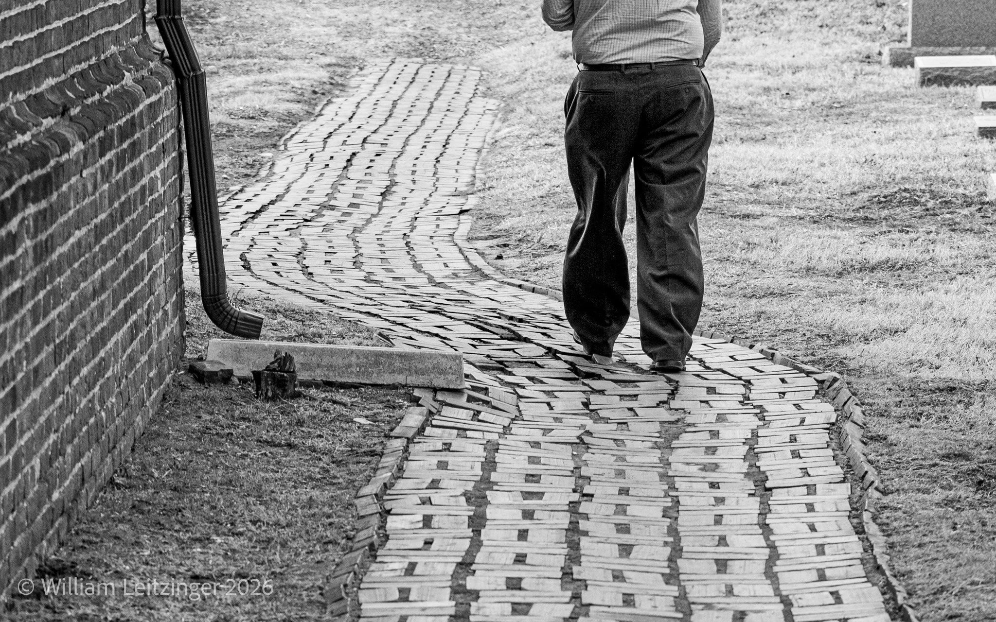20110217-Abstract-Urban-DE-Dover-Pants_of_Man_Walking_Down_Curved_Brick_Path-5571-B&W-Cropped_16x10-(Copyright) copy.jpg
