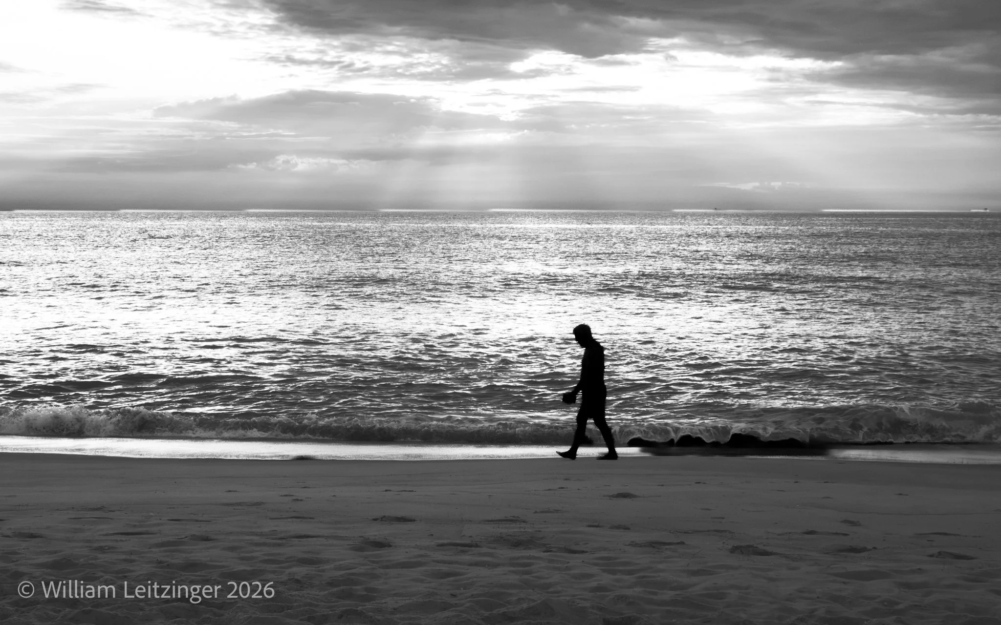 20190821-Landscape-Travel-Bethany_Beach-Man_Walks_on_Sand_Next_to_Ocean-01-B&W-(Copyright) copy.jpg
