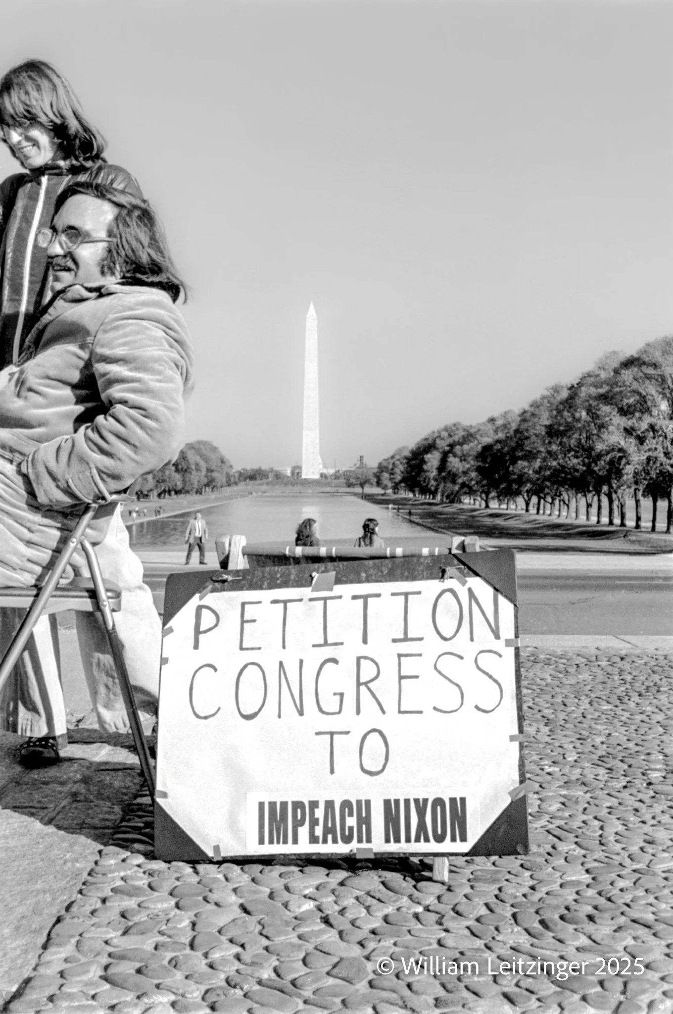 1974-Travel-Washington_DC-Impeach_Nixon_Protester_with_Washington_Monument_in_the_Background-01-B&W-(Copyright).jpg