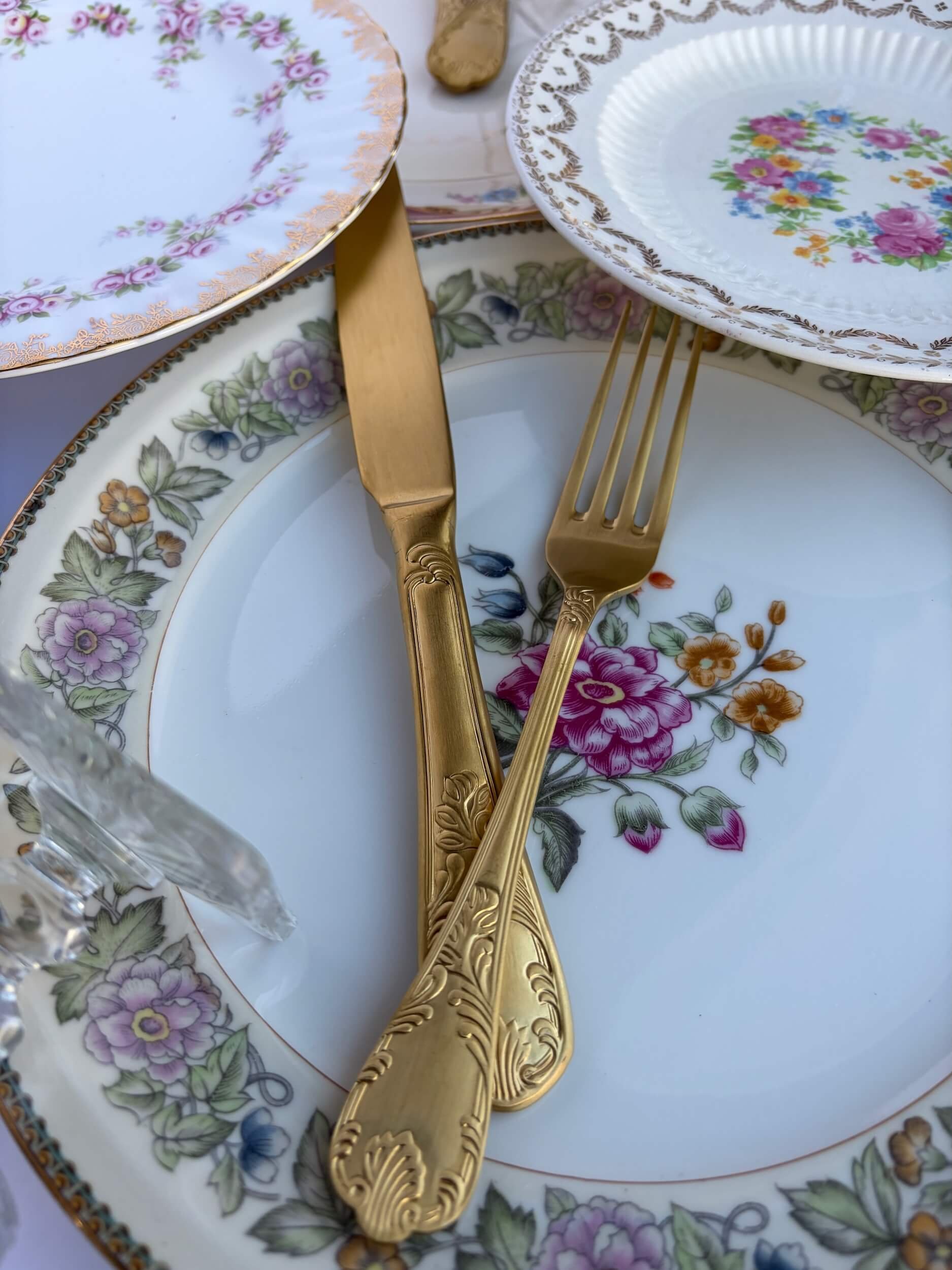 Vintage Plates and Gold Silverware Rentals.jpeg