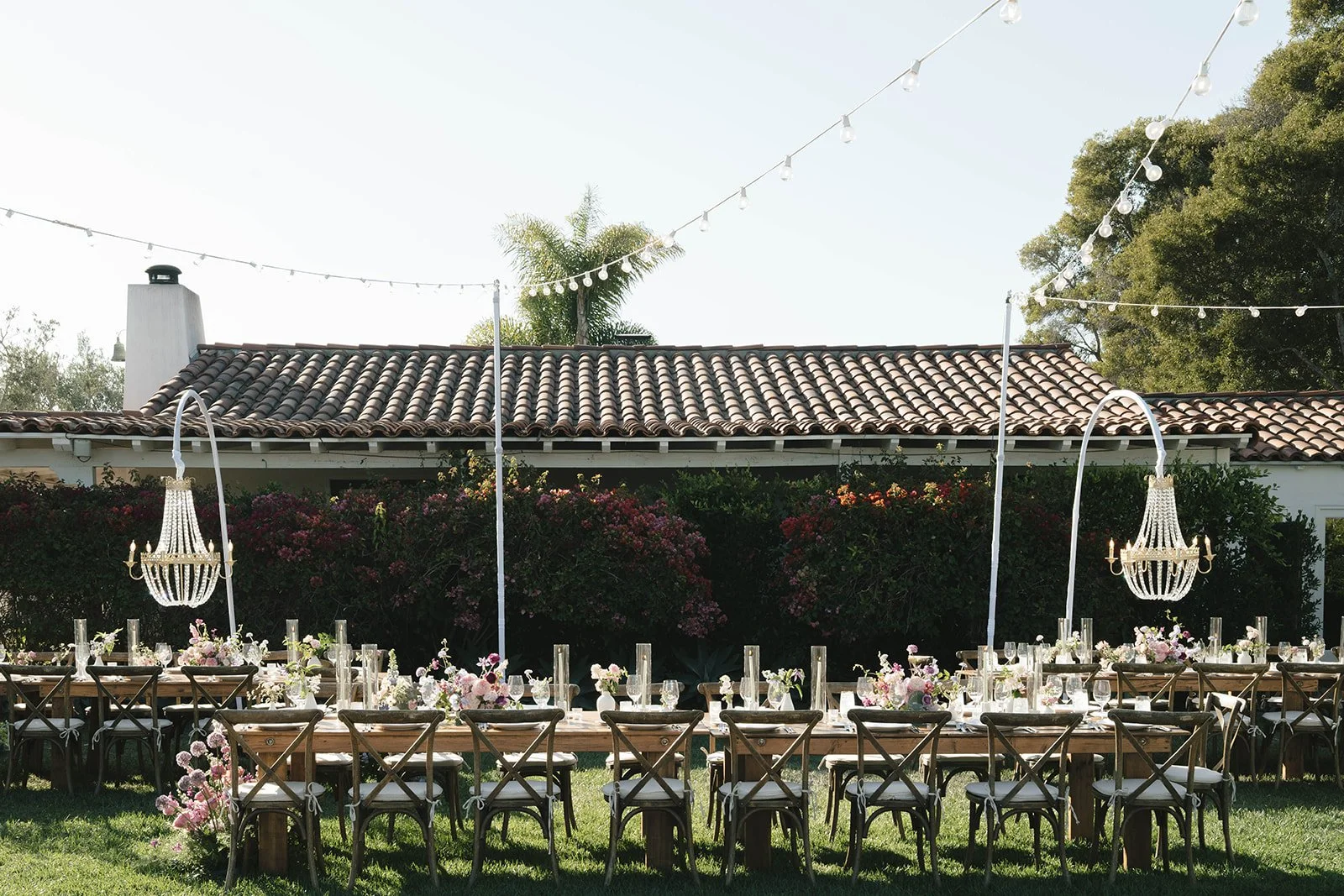  Lights strung, chandeliers over head, and long tables are some of the details that make up the reception. Digital. 