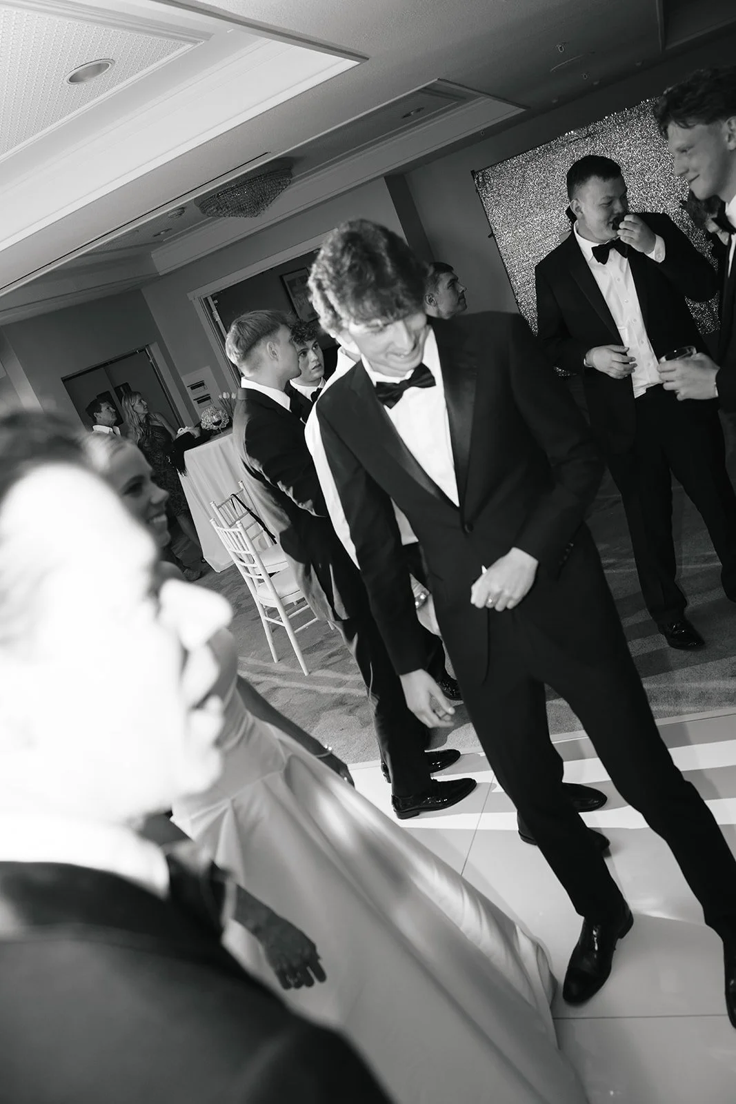 A candid moment of the Bride, Groom, and loved ones