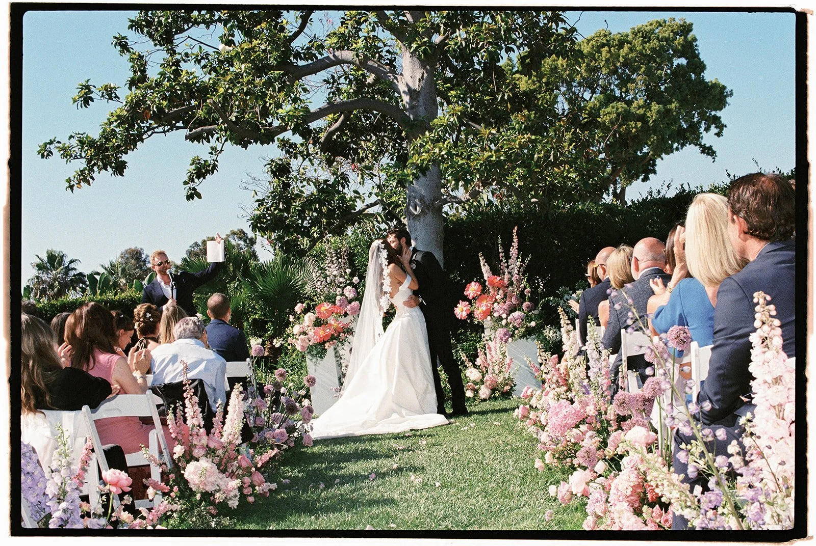 Their first kiss as husband and wife. 35 mm film. 
