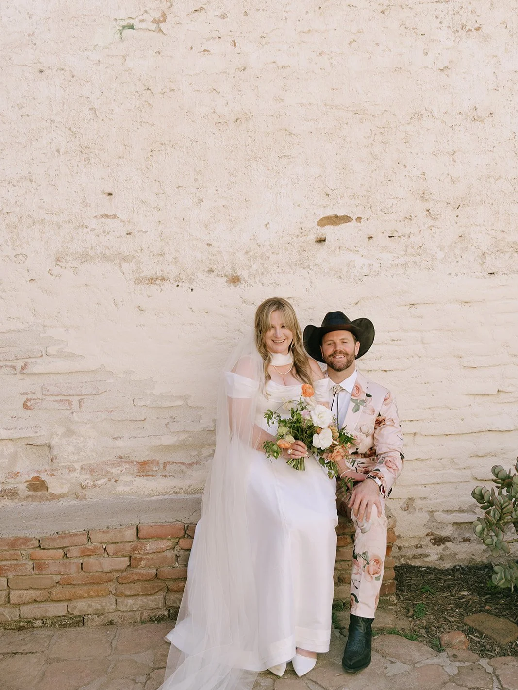 The bride and man of honor sitting