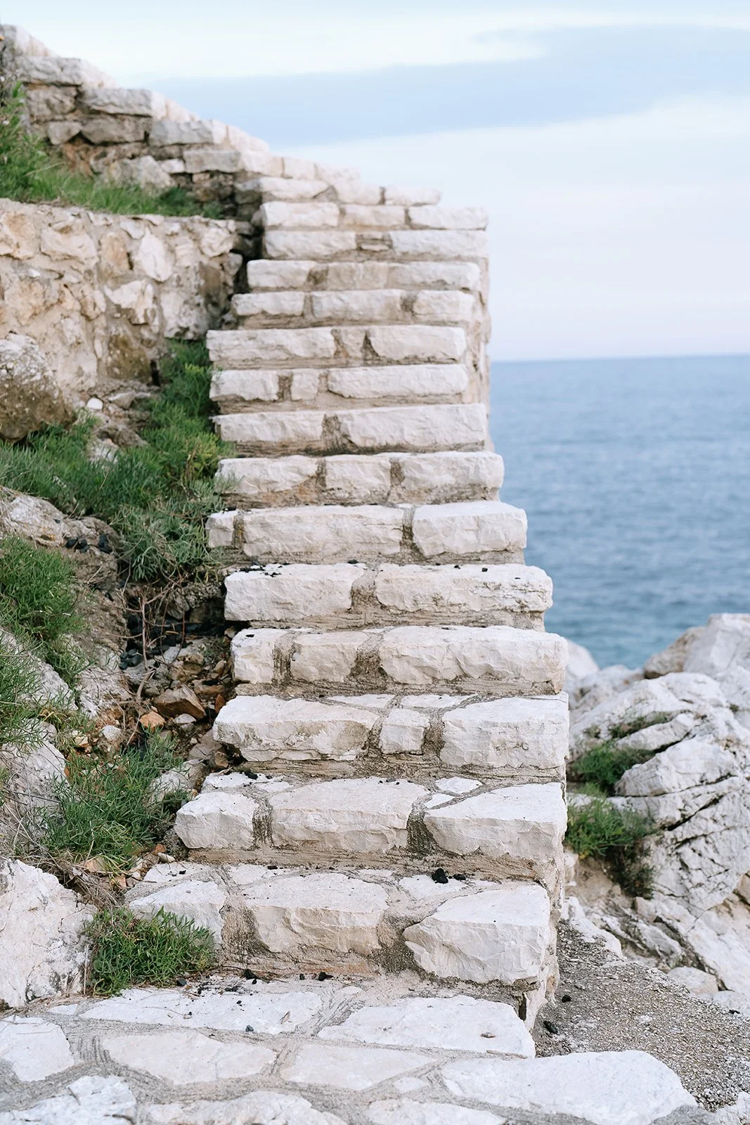 Stone staircase along the hillside of the Plage de Passable or Passable Beach on the Mediterranean coast