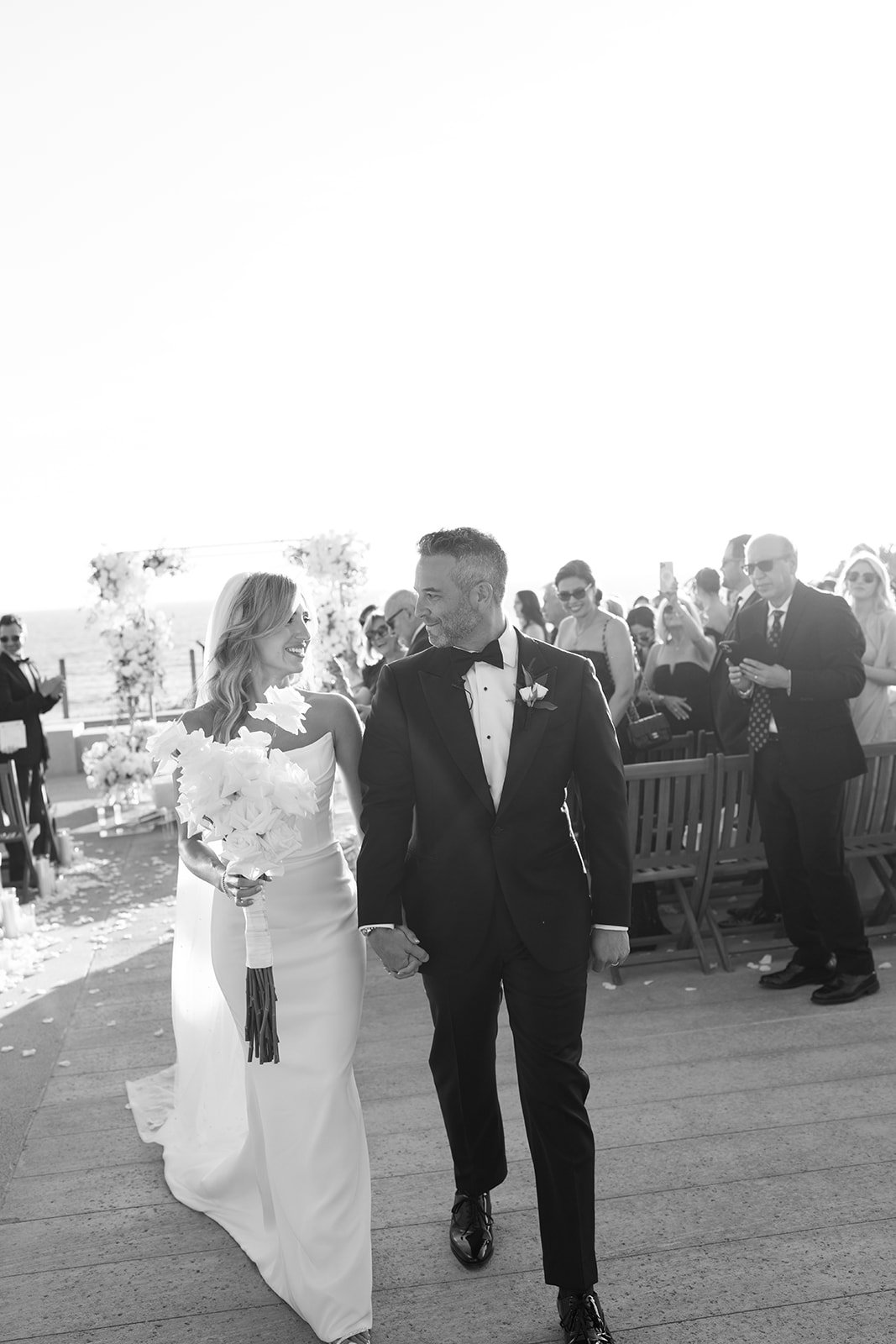 bride and groom look at each other modern luxury wedding