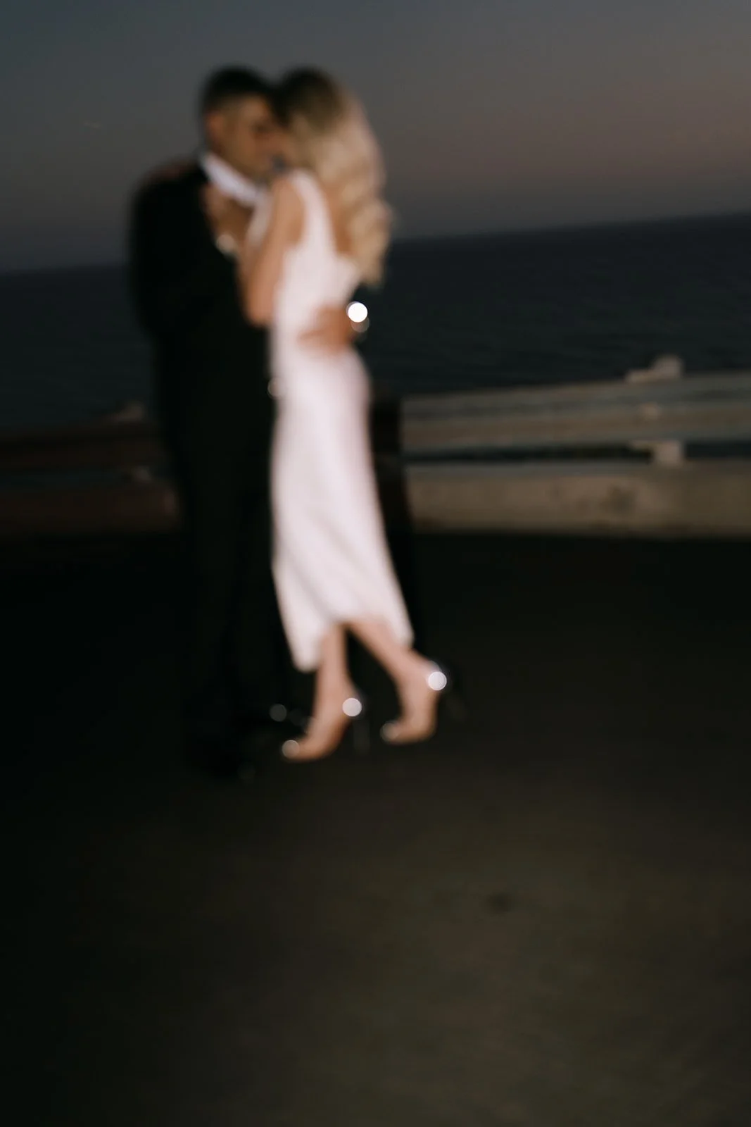 A blurry photo of the bride and groom