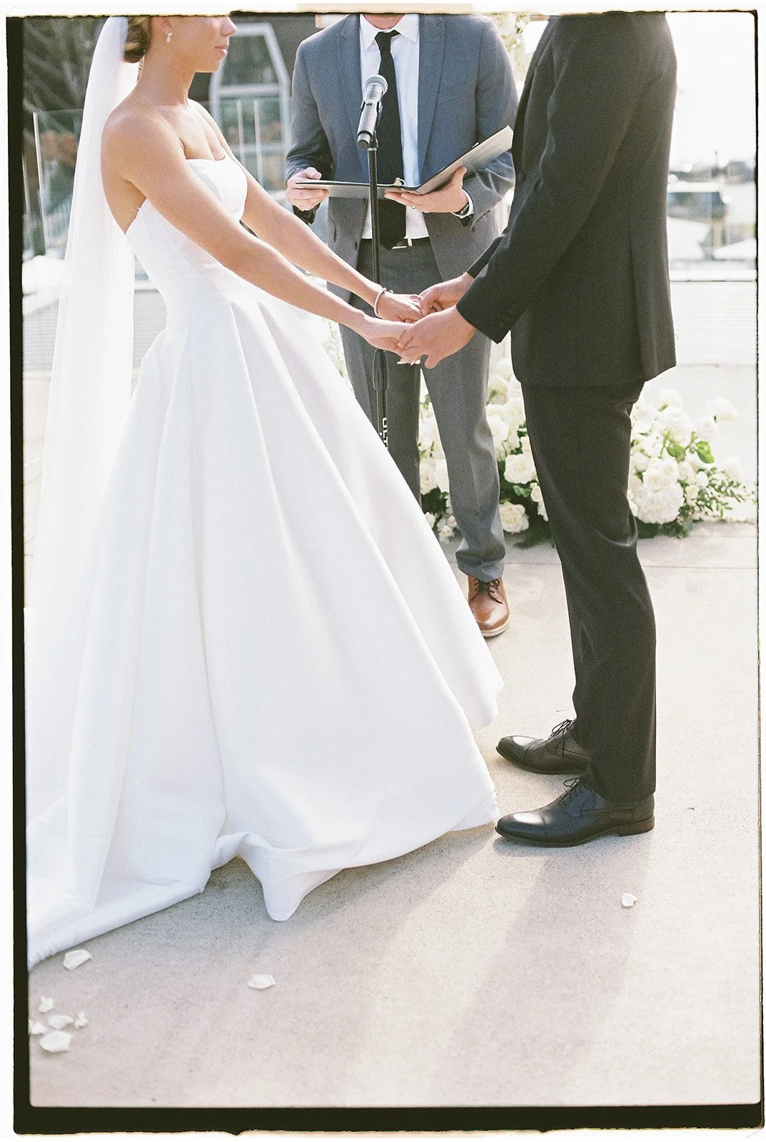 The bride and groom holding hands