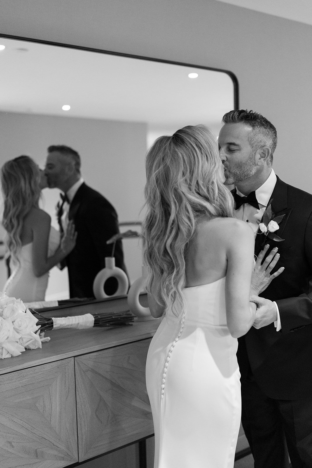 candid wedding photo kissing modern luxury editorial