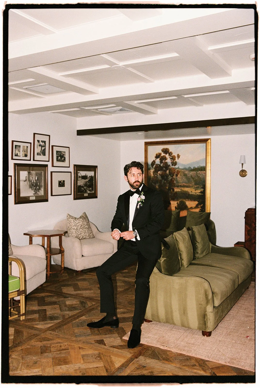  The groom in his final wedding look down to his Christian Louboutin dress shoes. 35 mm film. 