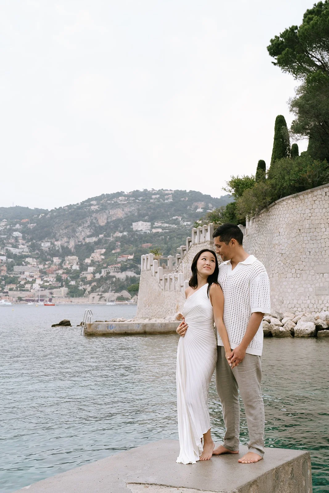 Couple standing together during their destination engagement photoshoot on the Mediterranean Coast in the South of France