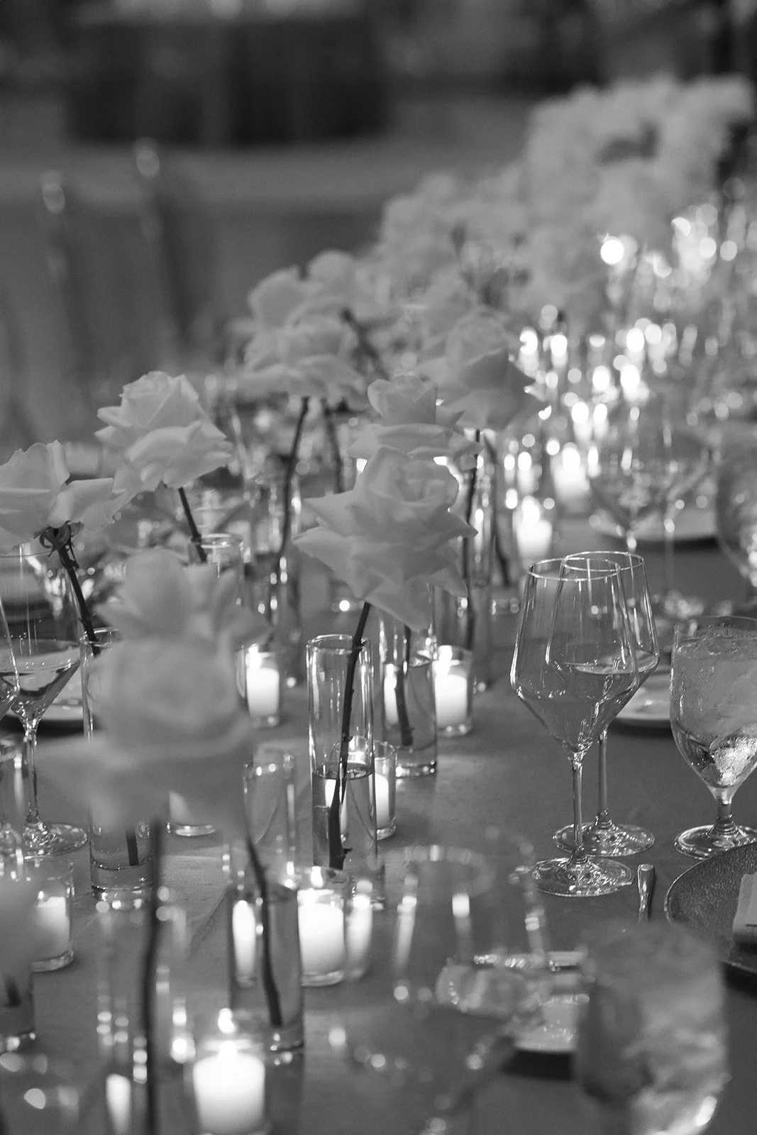 wedding tablescape reception details black and white candlelit dinner roses minimalist maximalist