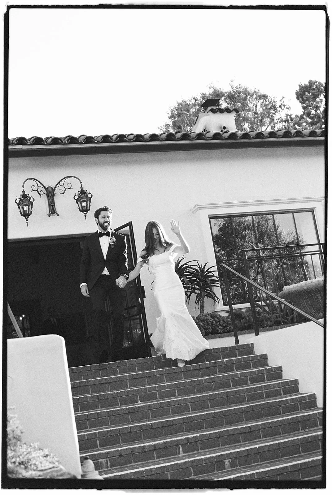  The bride and groom make their grand entrance. 35 mm film. 