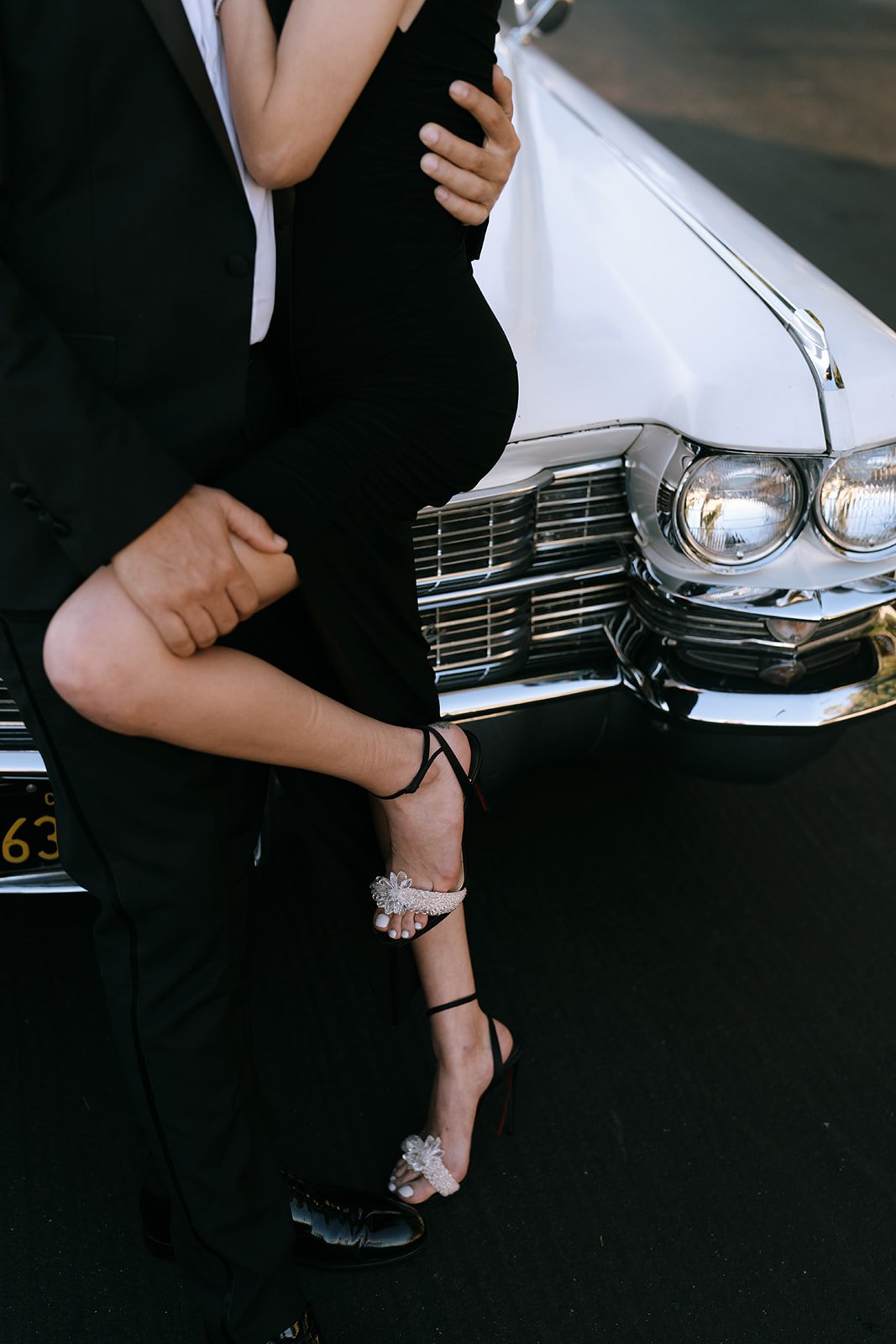 A close-up of the Louboutin black shoes the bride is wearing.