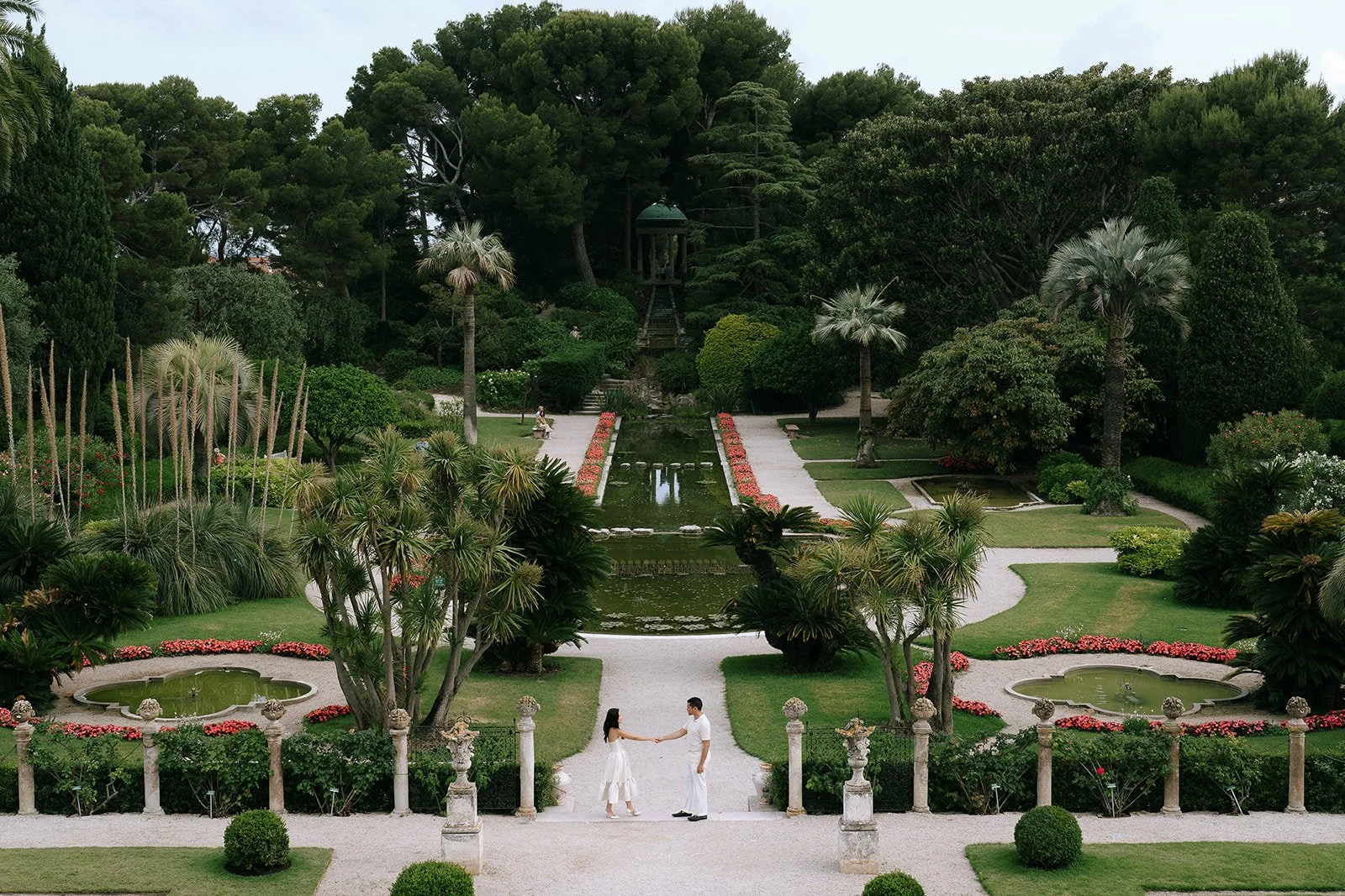 Couple standing in the French Garden of the Villa Ephrussi De Rothschild in Saint-Jean-Cap-Ferrat in the South of France